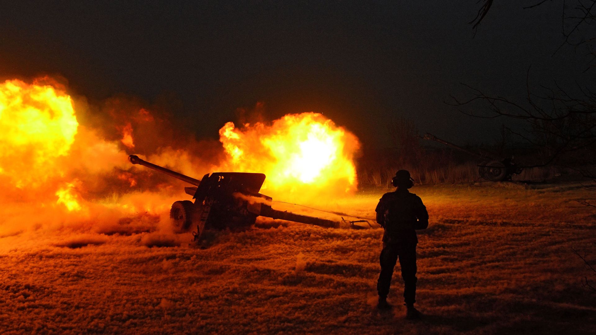 An Afghan National Army soldier fires an artillery shell.