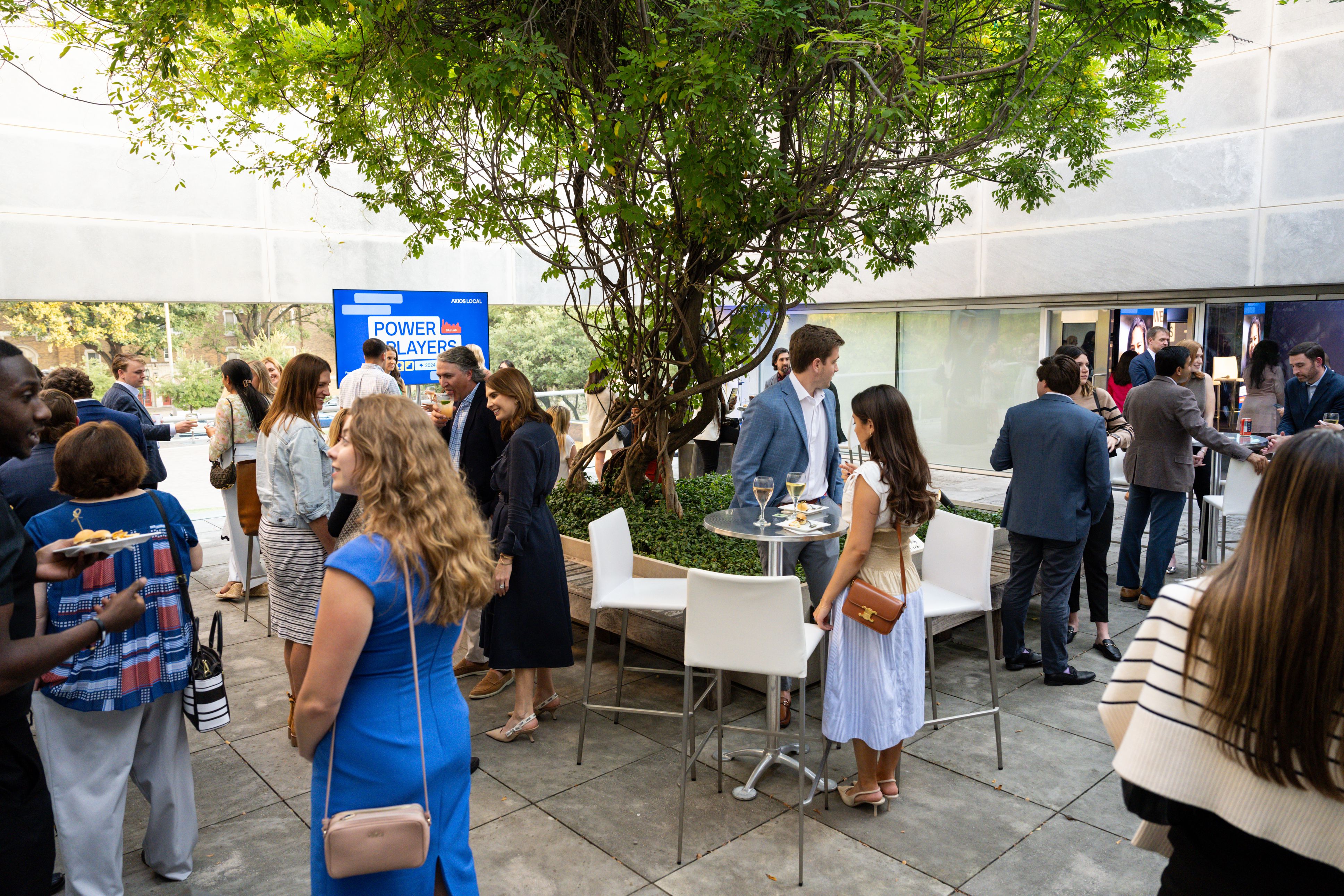 group of guests gather on the outdoor patio