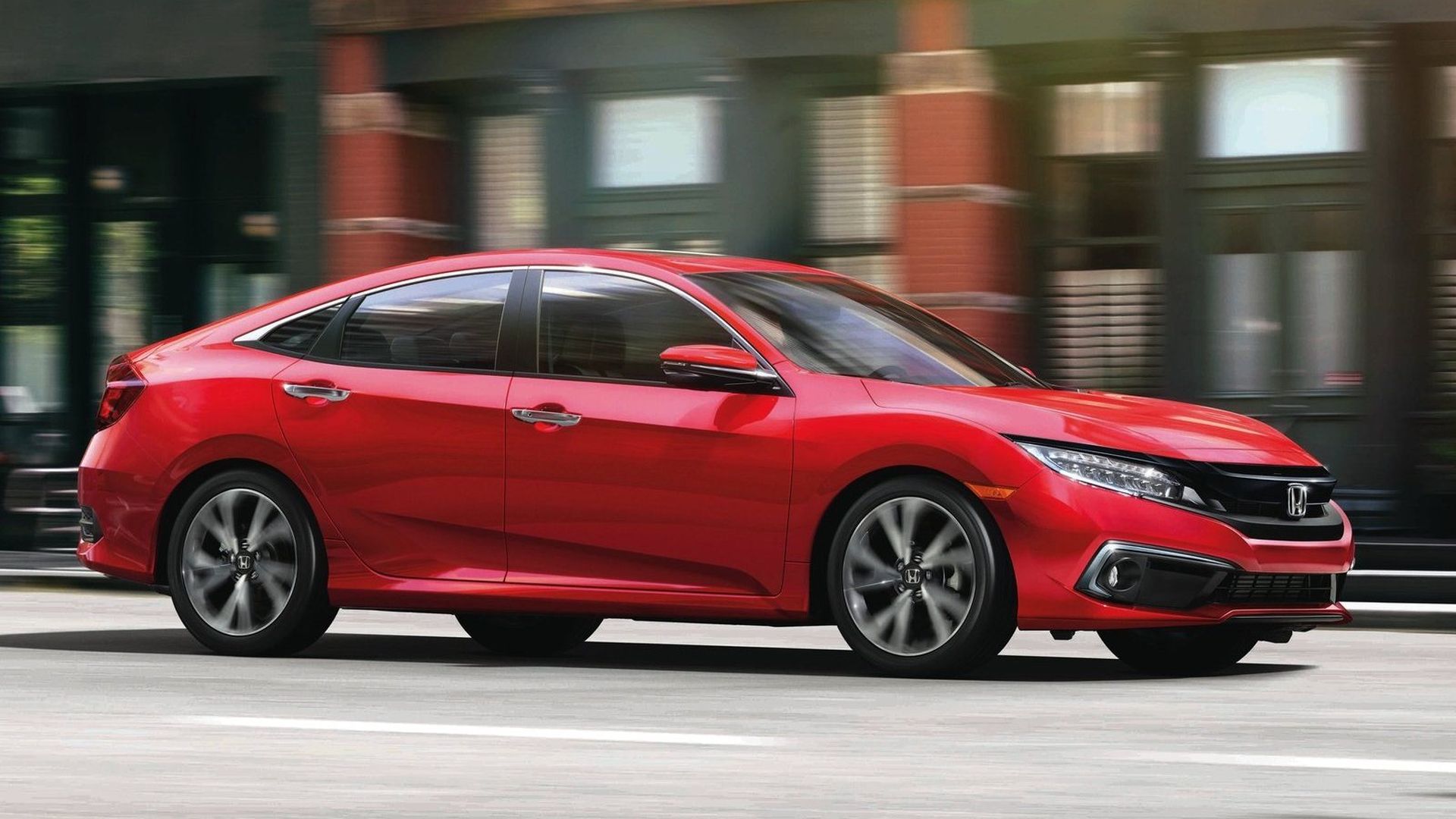 This image shows the Honda Civic driving down the road.