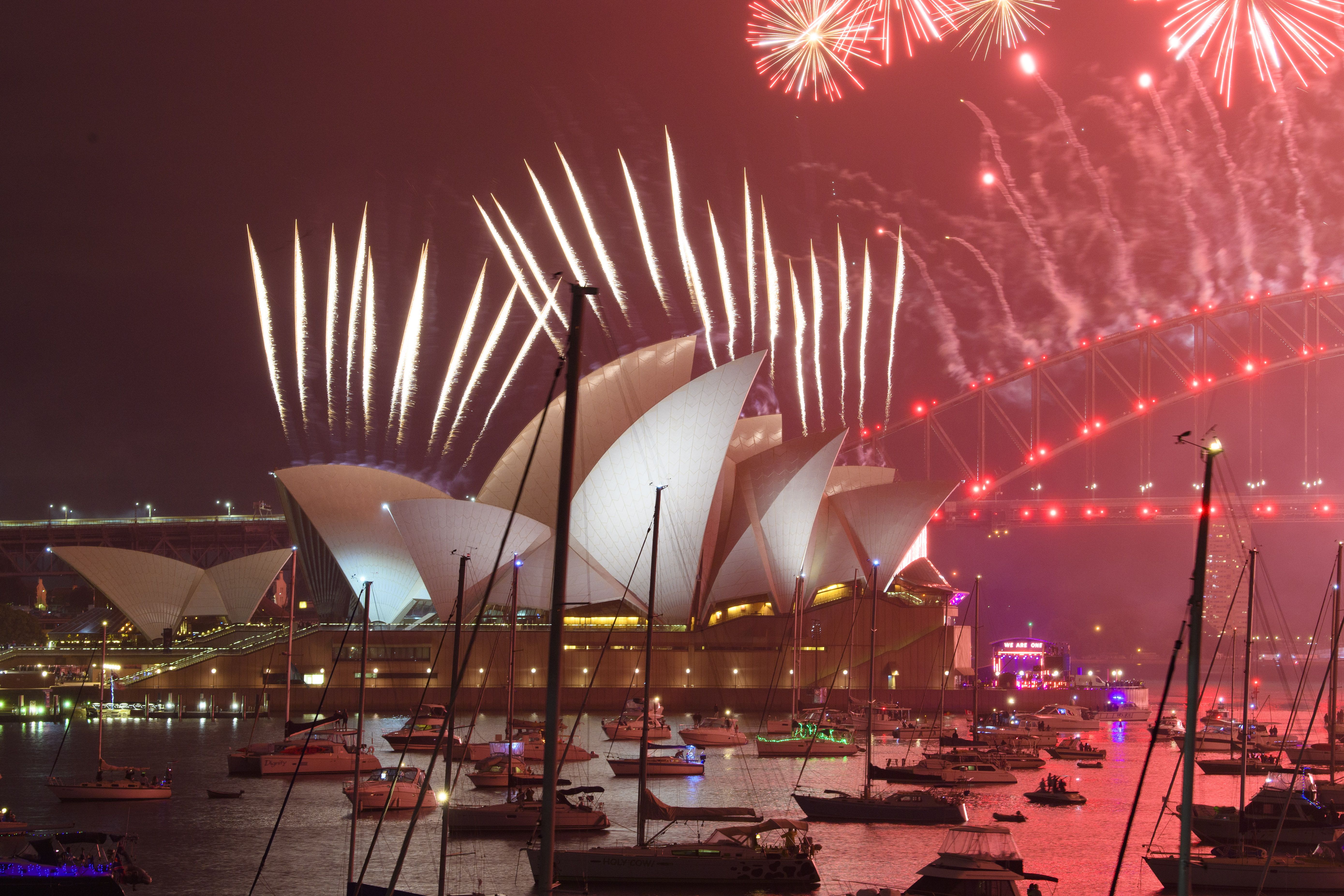 A fireworks display is seen over the Sydney Harbour Bridge during New Year's Eve celebrations in Sydney, Australia. 