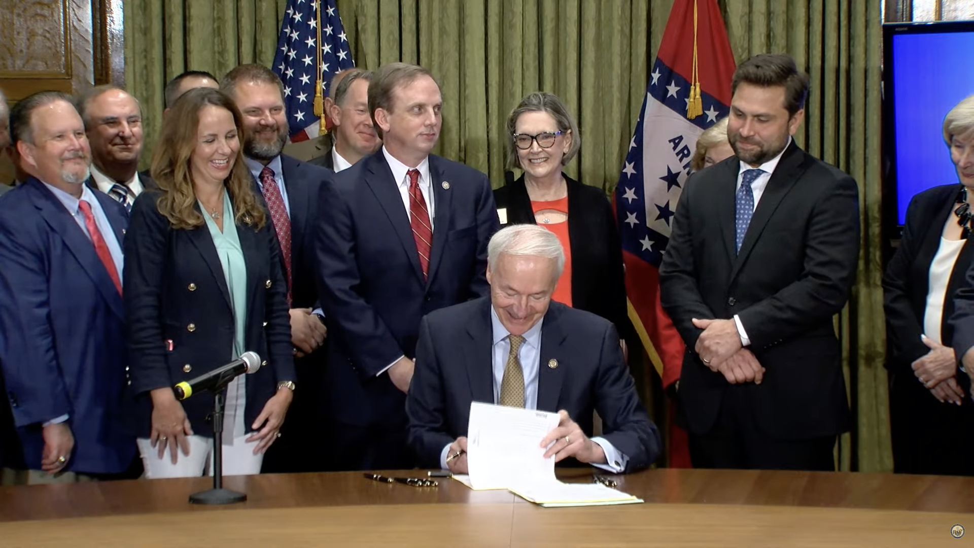 Arkansas Gov. Asa Hutchinson signs tax cut legislation.
