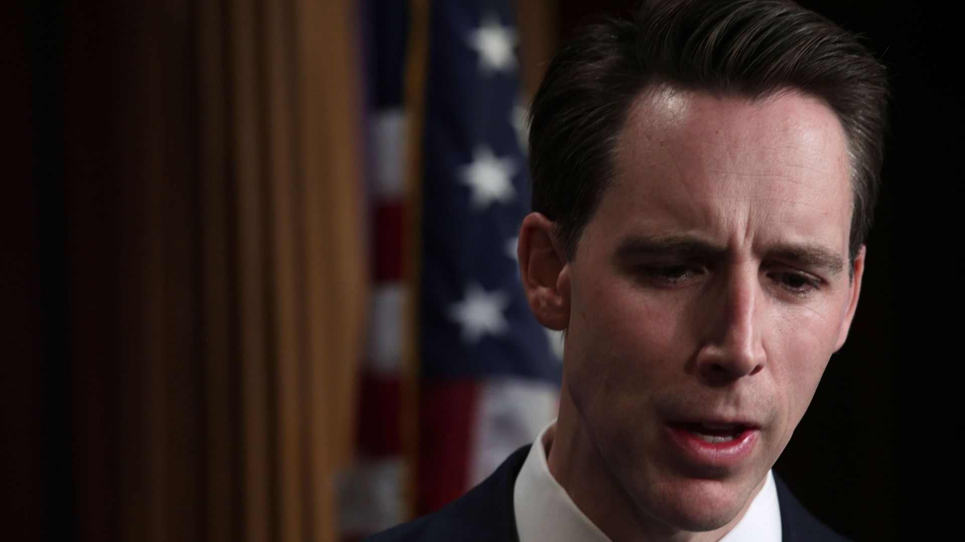 A close up of a man in a suit
