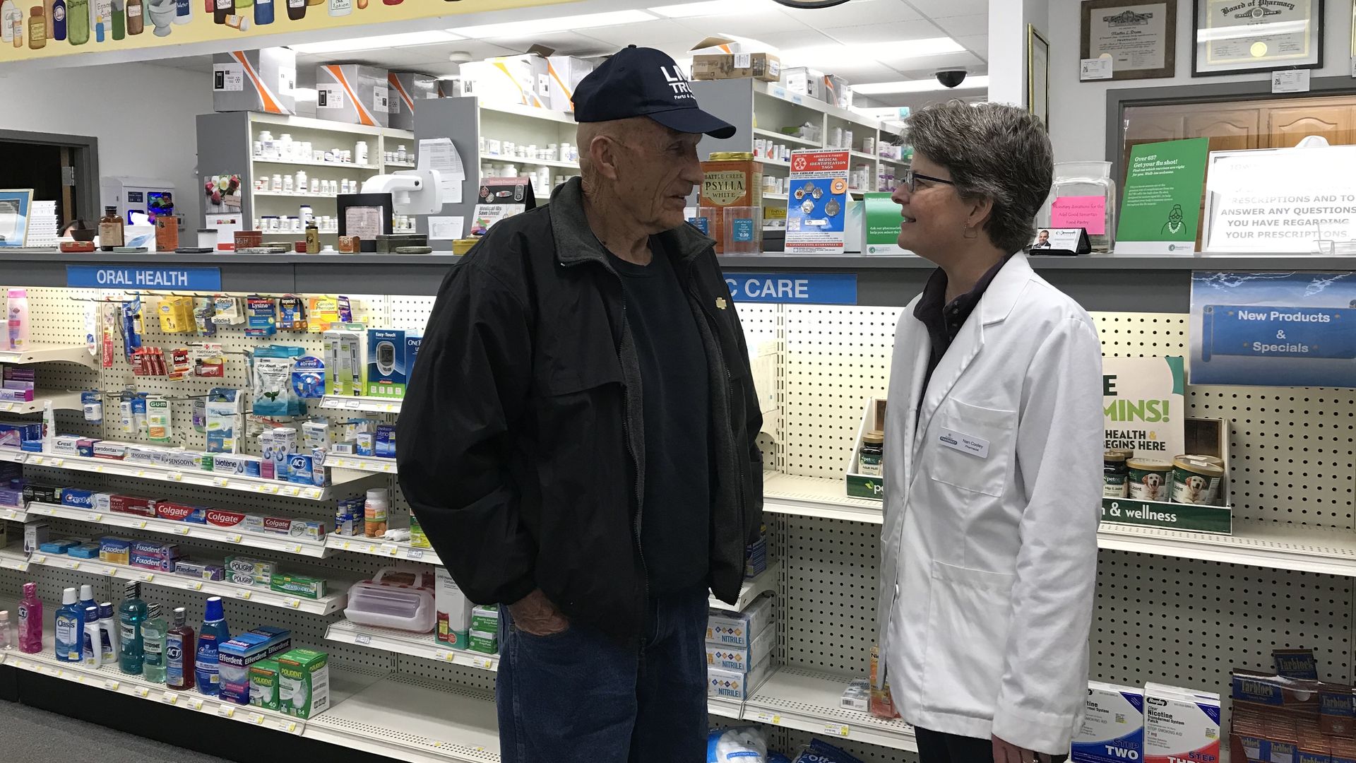 A patient and pharmacist at Sumpter Pharmacy in Adel.