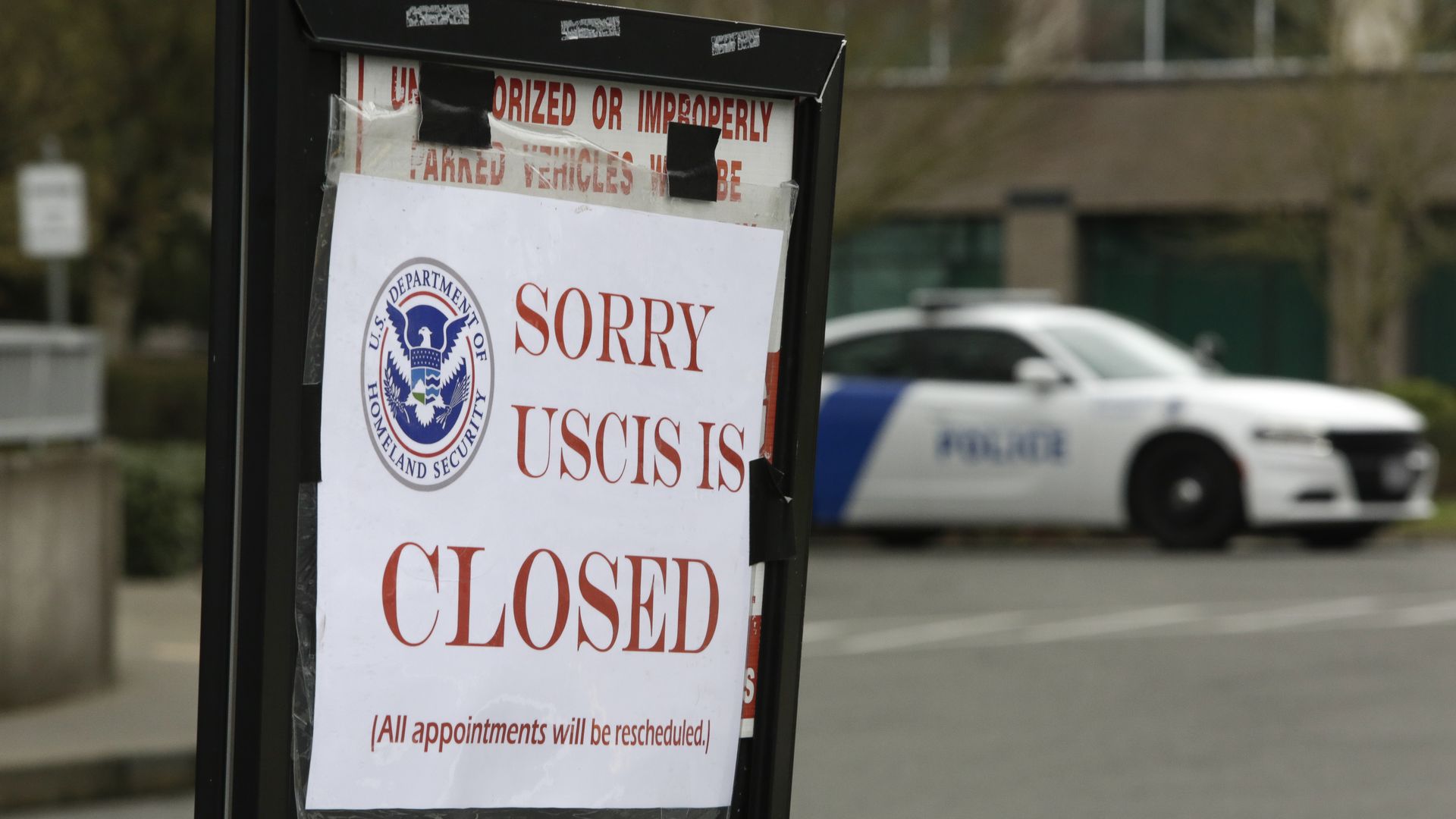 A sign that reads: "Sorry USCIS is closed" 