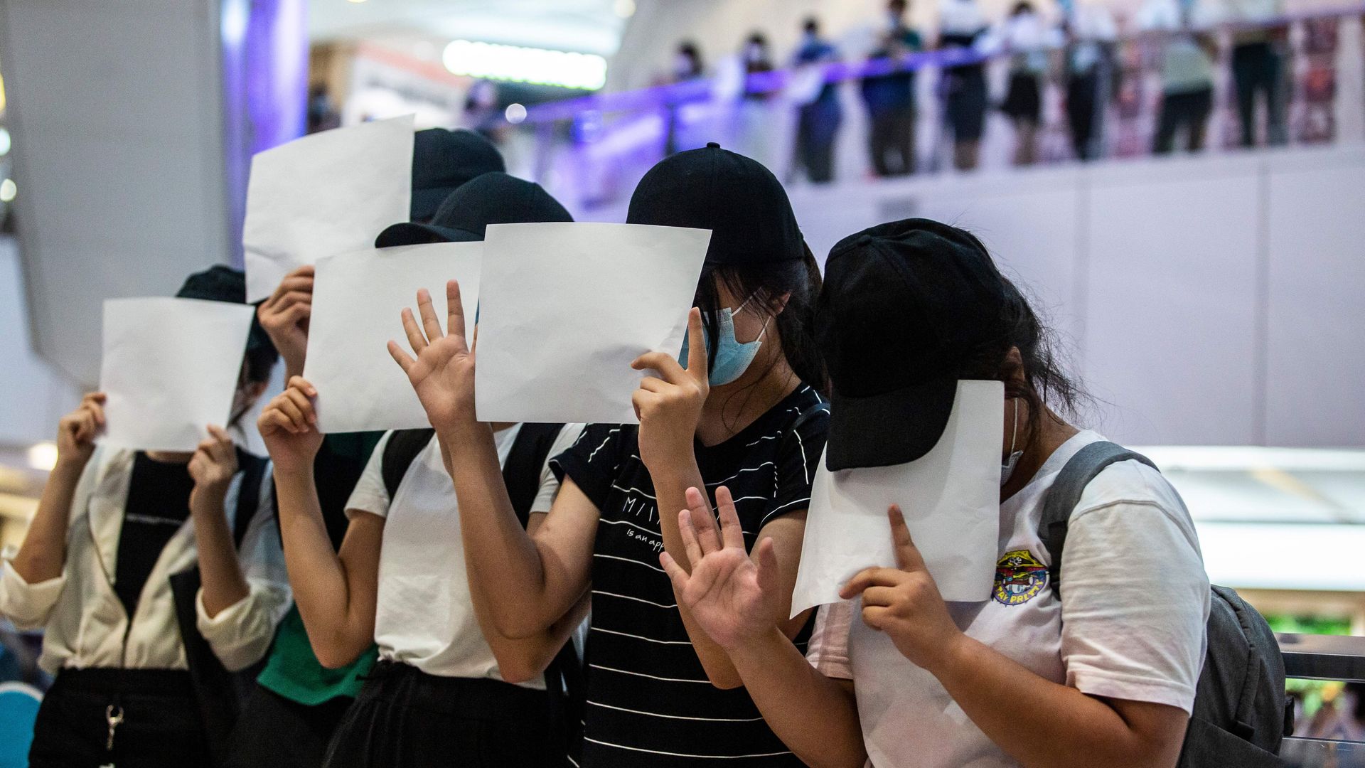 Protesters hold up blank papers during a demonstration in Hong Kong on July 6, 2020
