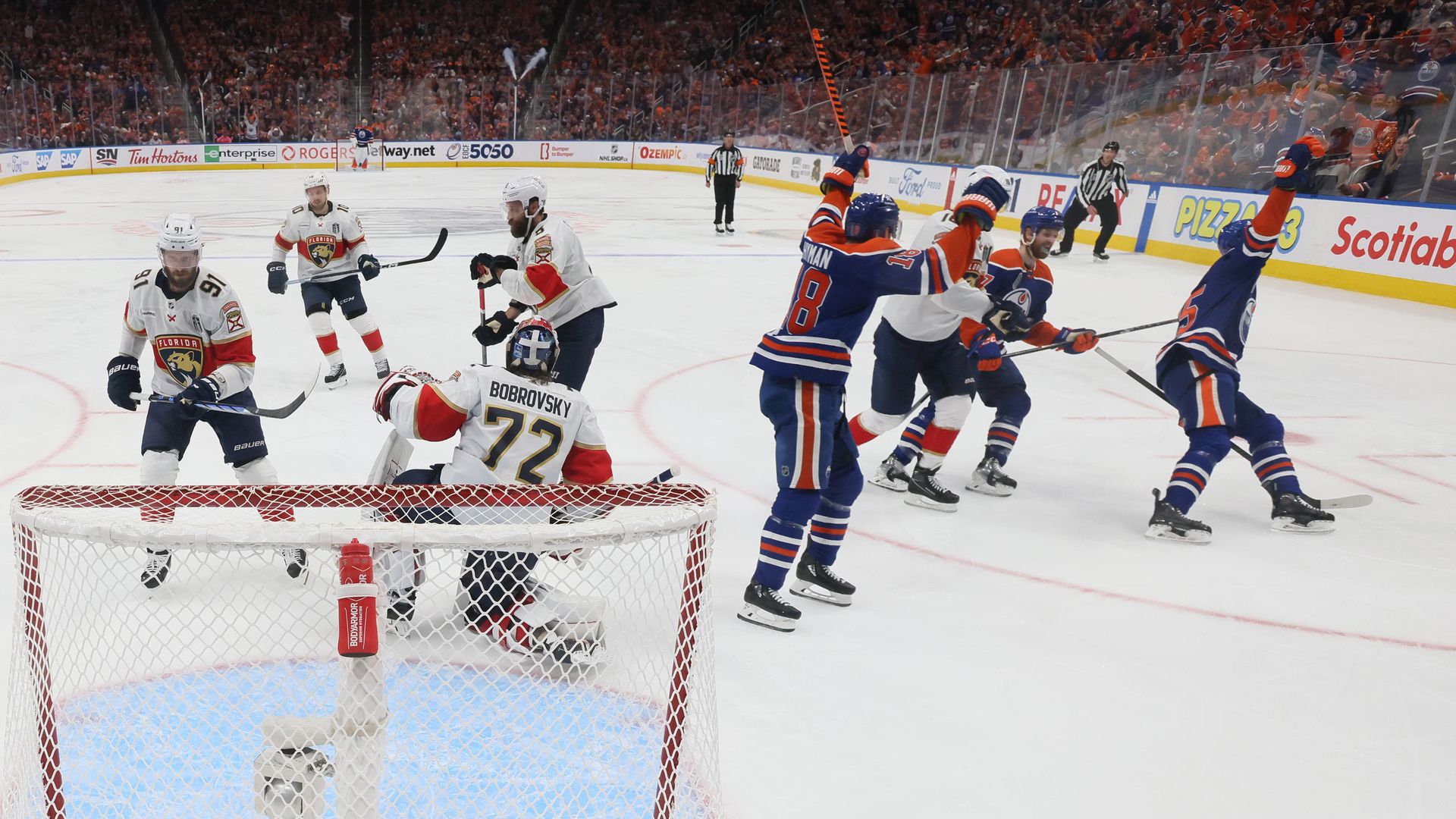 Oliver Ekman-Larsson #91 and Sergei Bobrovsky #72 of the Florida Panthers react while Zach Hyman #18 and Darnell Nurse #25 of the Edmonton Oilers celebrate after Nurse's goal during the second period of Game Four of the 2024 Stanley Cup Final at Rogers Place