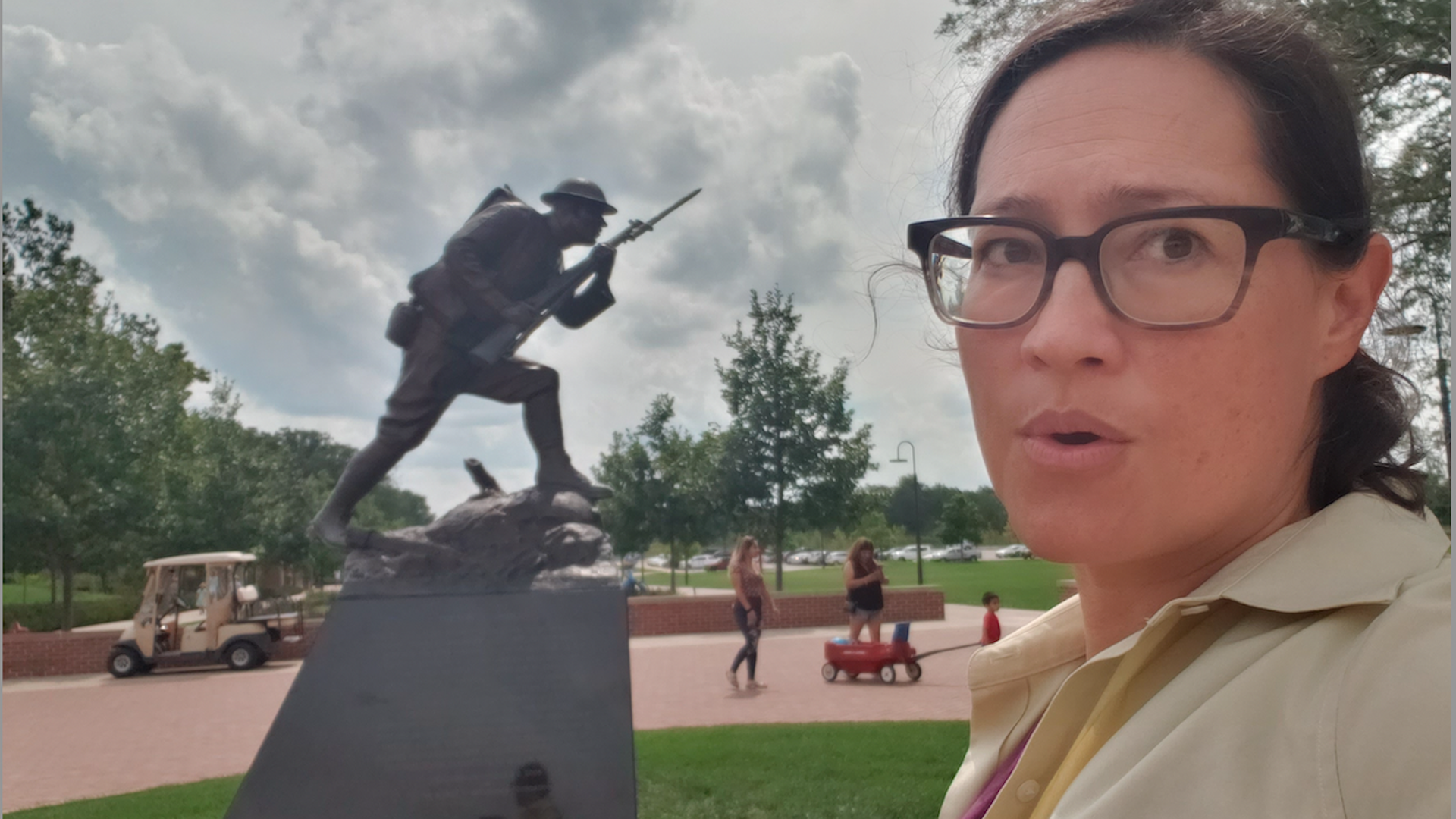 Woman in front of a WWI statue