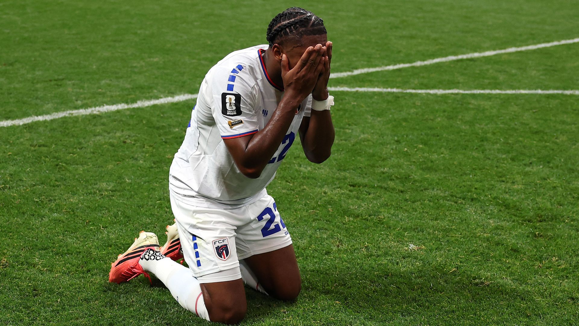 Cape Verde defender Steven Moreira drops to his knees and holds his head in his hands after a stunning draw against Spain. 