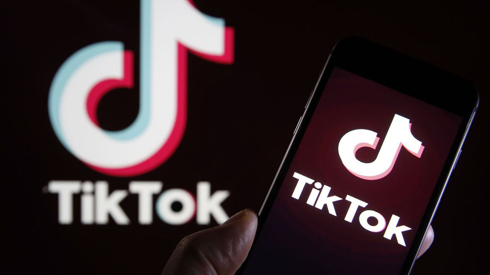 Image of the Tiktok logo on a smartphone. 