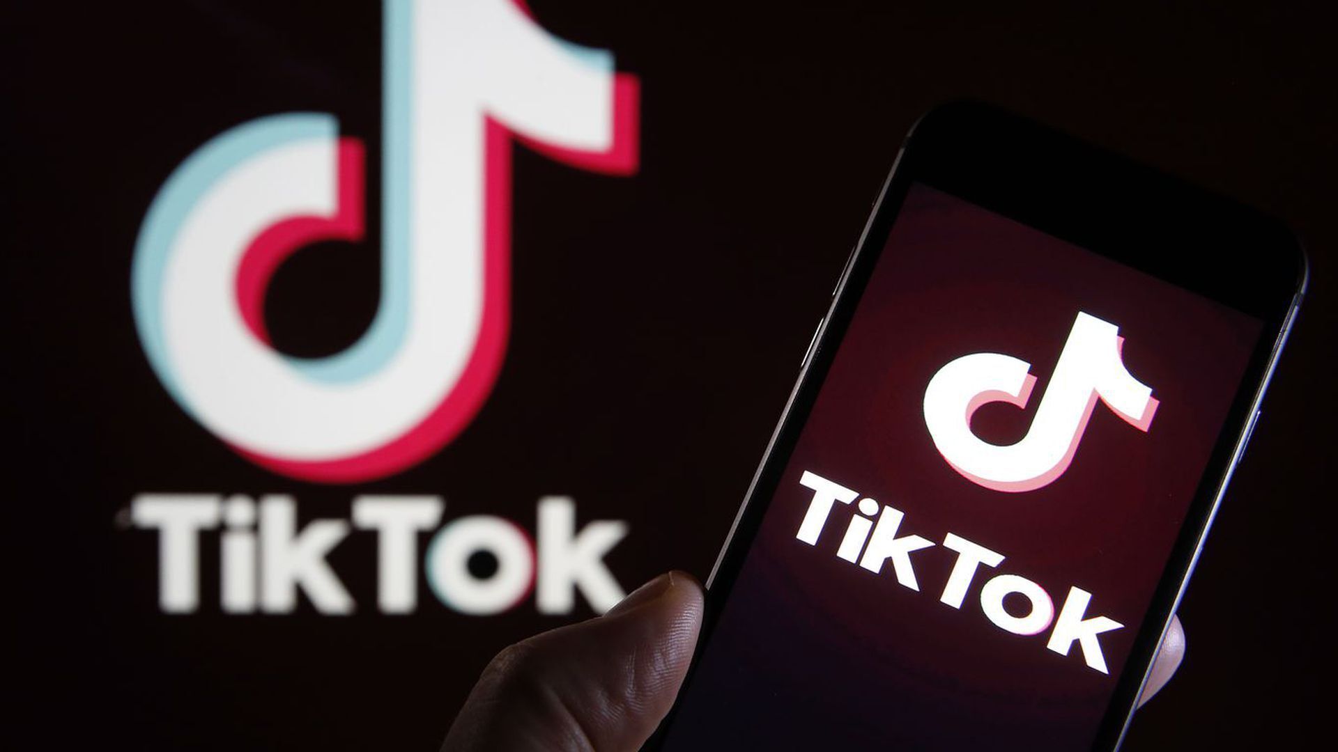 Image of the Tiktok logo on a smartphone.