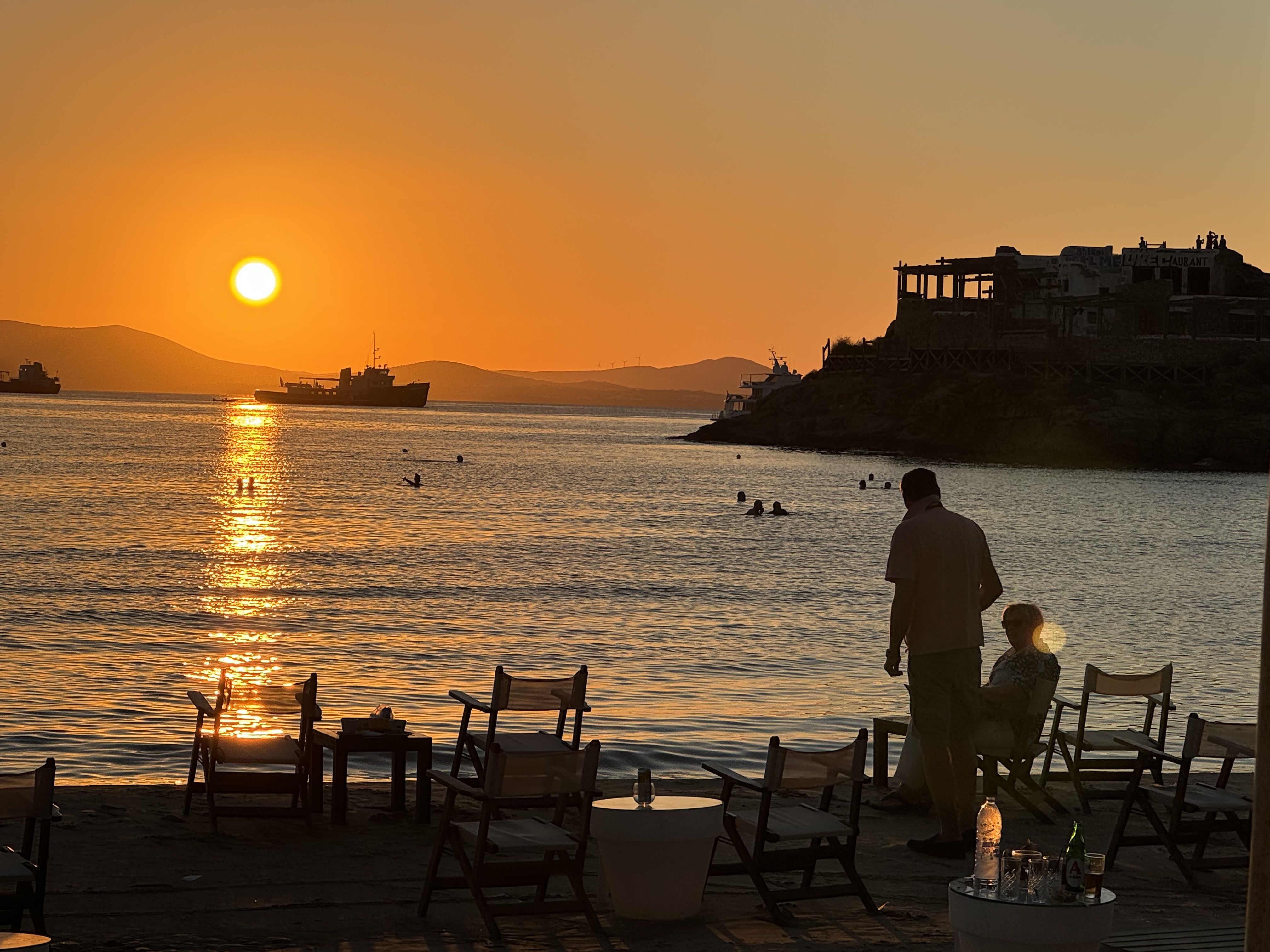 Silhouettes on a beach at sunset