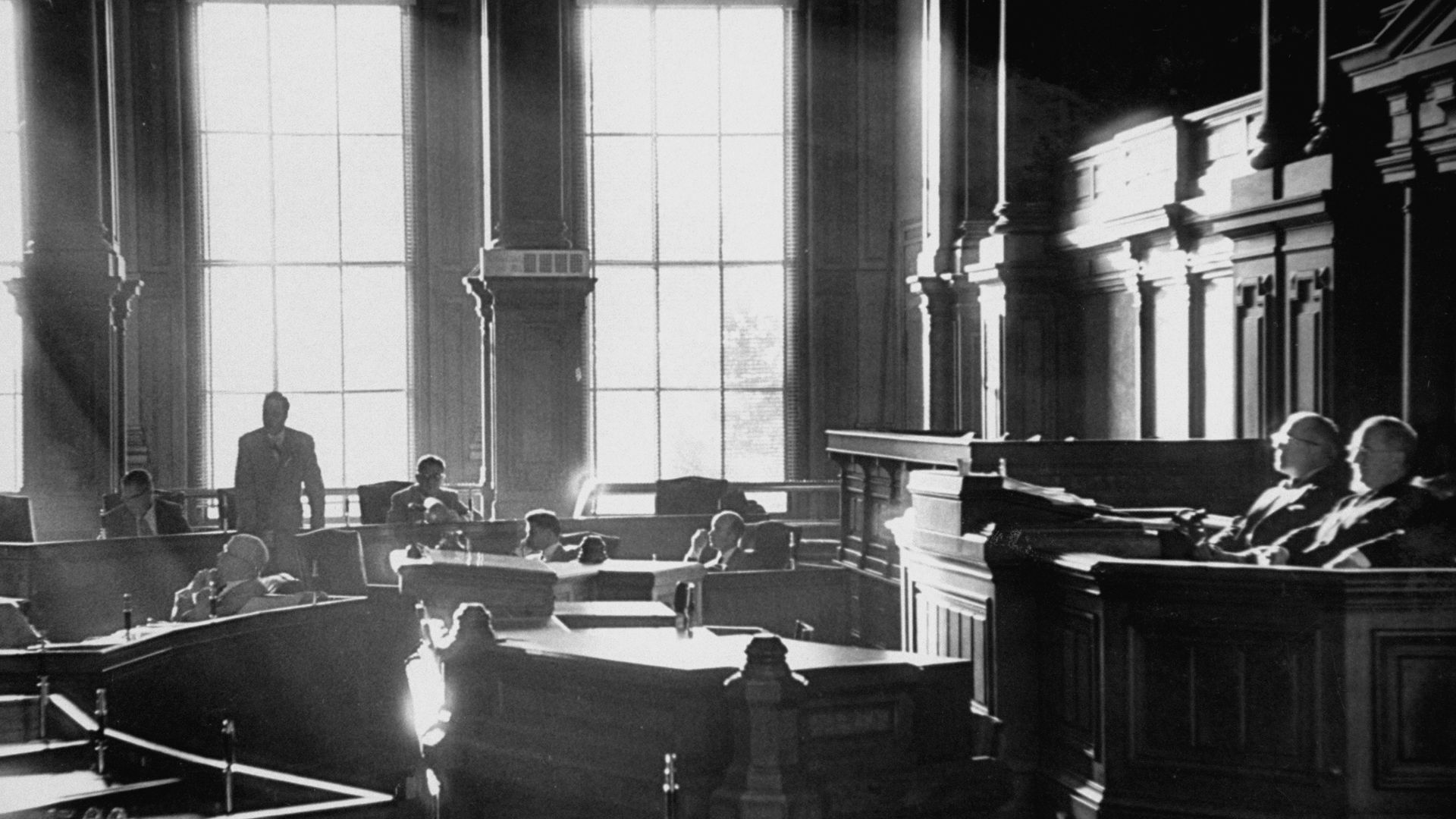 A black and white photo of a courtroom