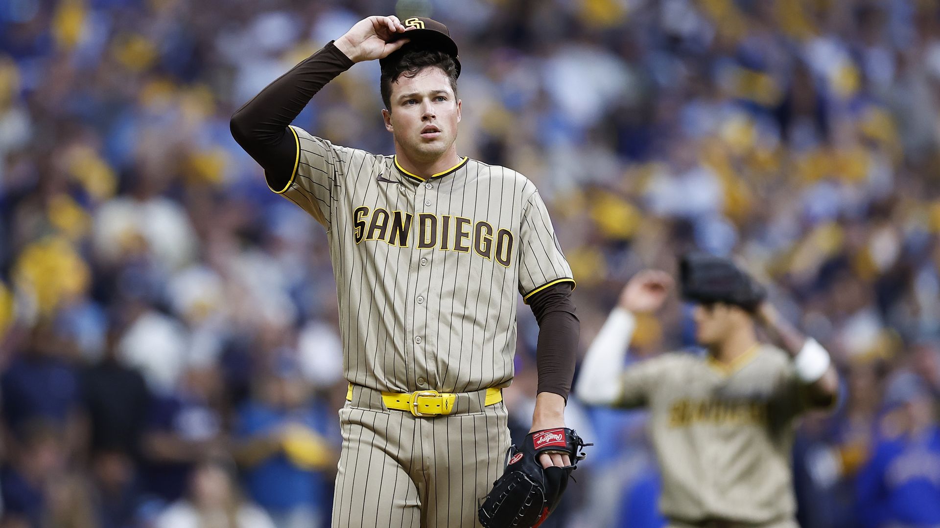 Milwaukee, Wisconsin - October 04: Mason Miller #22 of the San Diego Padres adjusts his cap after walking Gary Sanchez #99 of the Milwaukee Brewers during the ninth inning of Game 2 of the National League Division Series at American Family Field on Sunday, Oct. 4, 2026 in Milwaukee, Wisconsin. (Phot