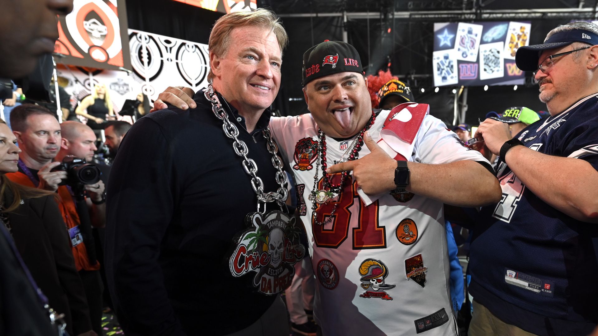 NFL Commission Roger Goodell (L) poses with Tampa Bay Buccaneers fan Rob Thompson