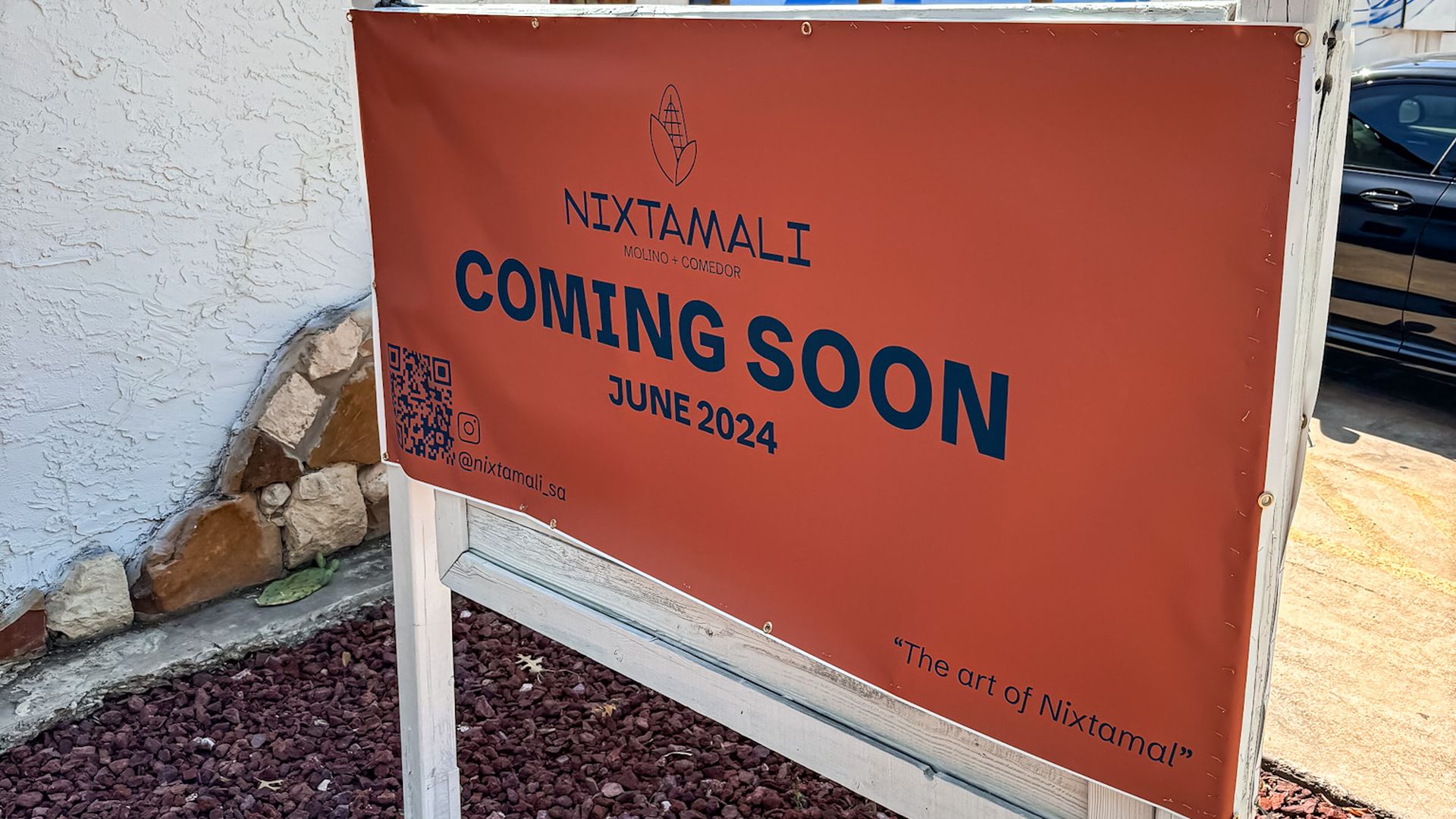 An orange sign saying "Nixtamali coming soon June 2024."