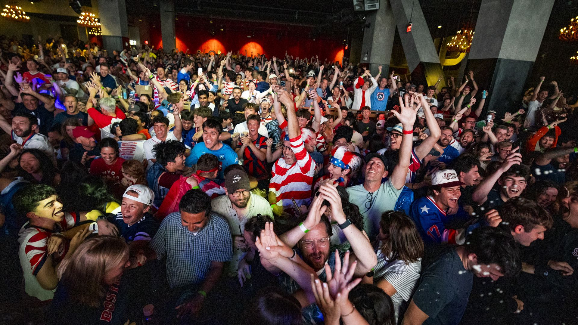 team usa fans cheering at a bar
