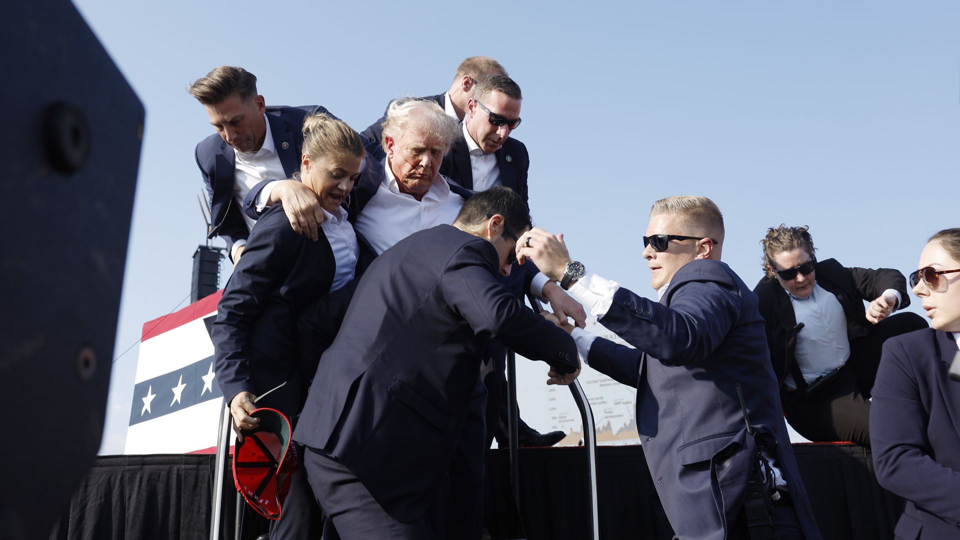Donald Trump is rushed offstage during a rally on July 13, 2024 in Butler, Pennsylvania