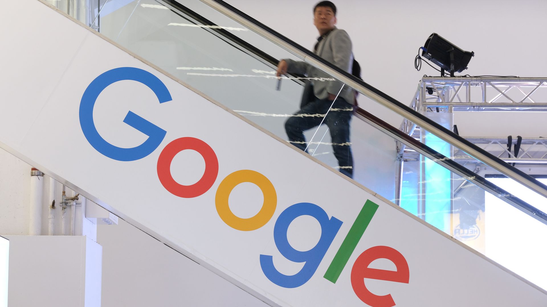 Google's logo on an escalator