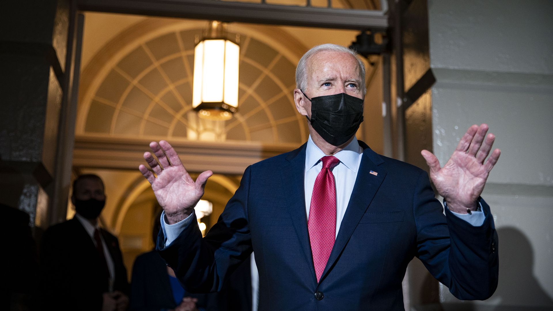 U.S. President Joe Biden speaks with members of the media while departing from a House Democratic caucus meeting