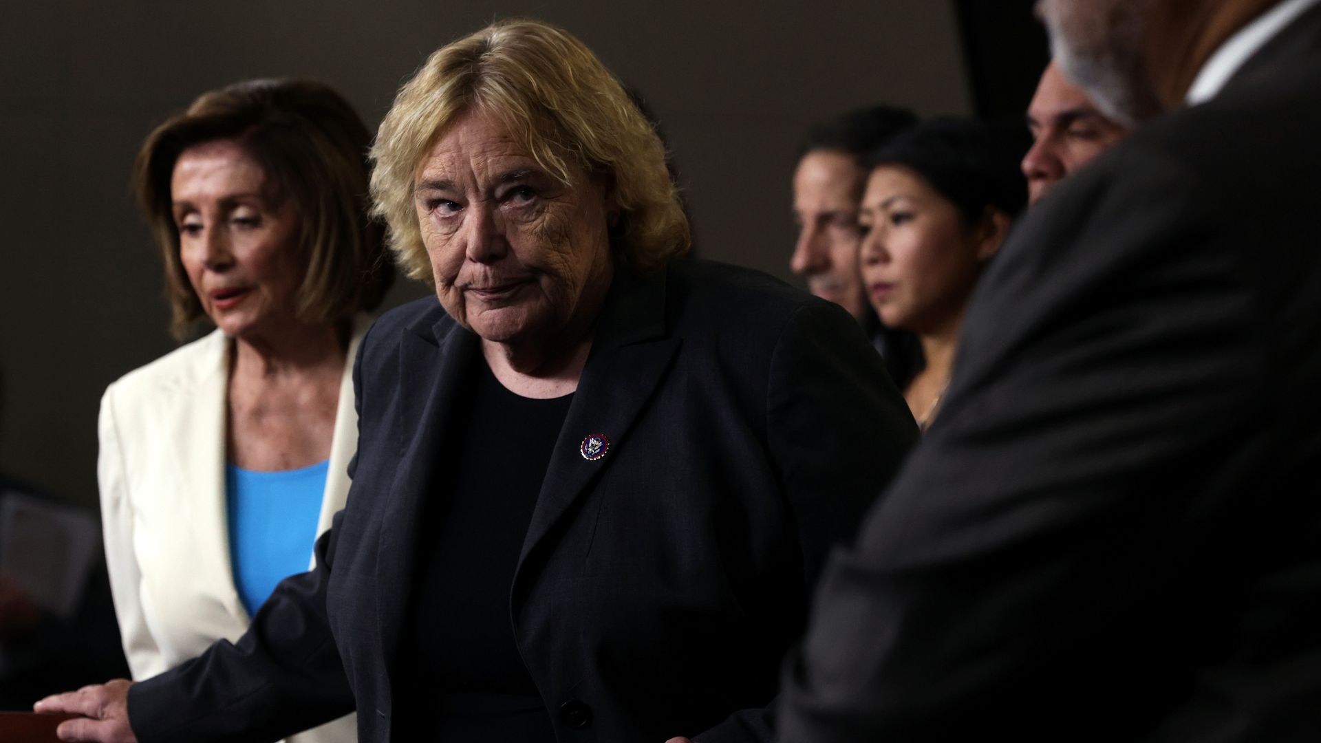 Rep. Zoe Lofgren, wearing a dark gray jacket, black blouse and member pin.