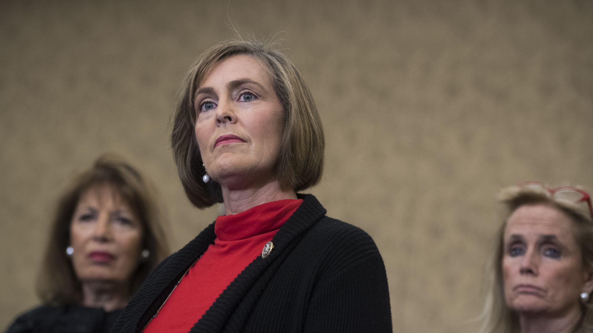 A photo of Rep. Kathy Castor standing in the foreground of other Congresswomen.