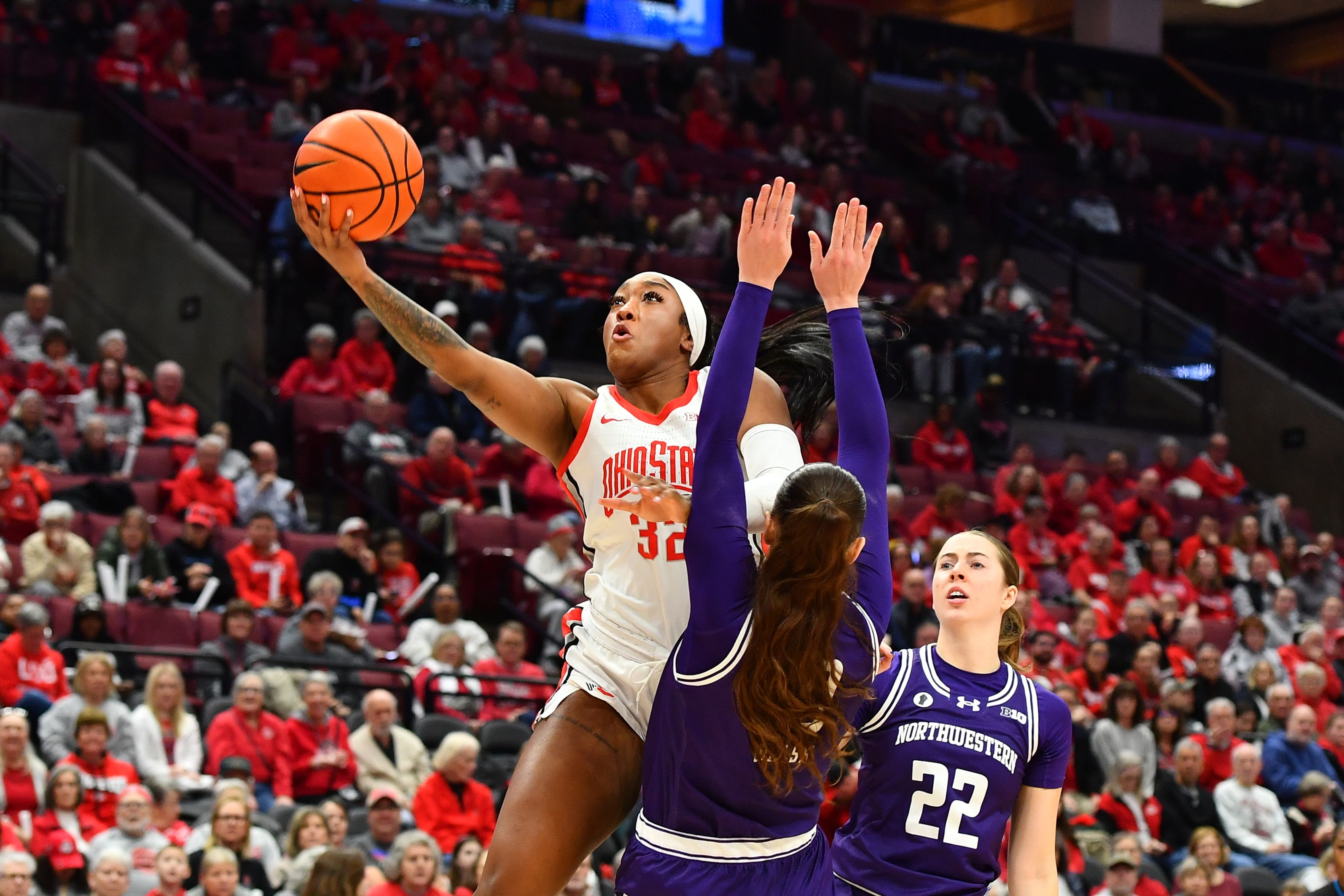 Ohio State's Cotie McMahon drives past a Northwestern defender