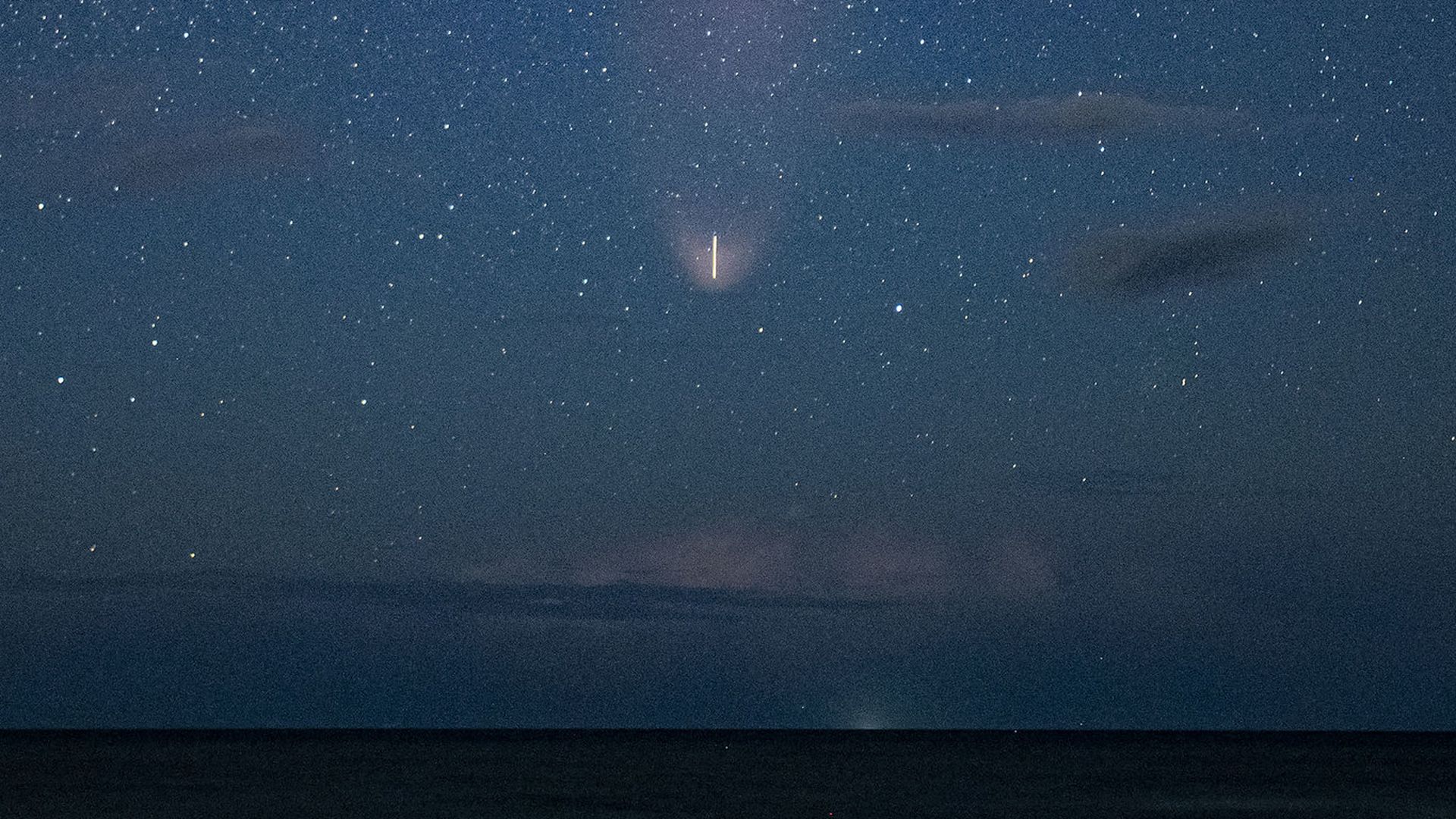 A Falcon 9 rocket in the late twilight.