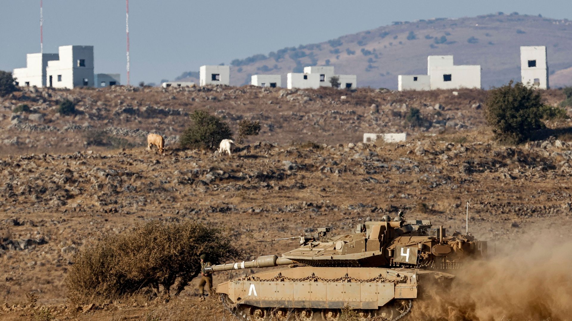 An Israeli Merkava battle tank takes part in a military drill in the Israeli-annexed Golan Heights, near the border with Syria, on August 4