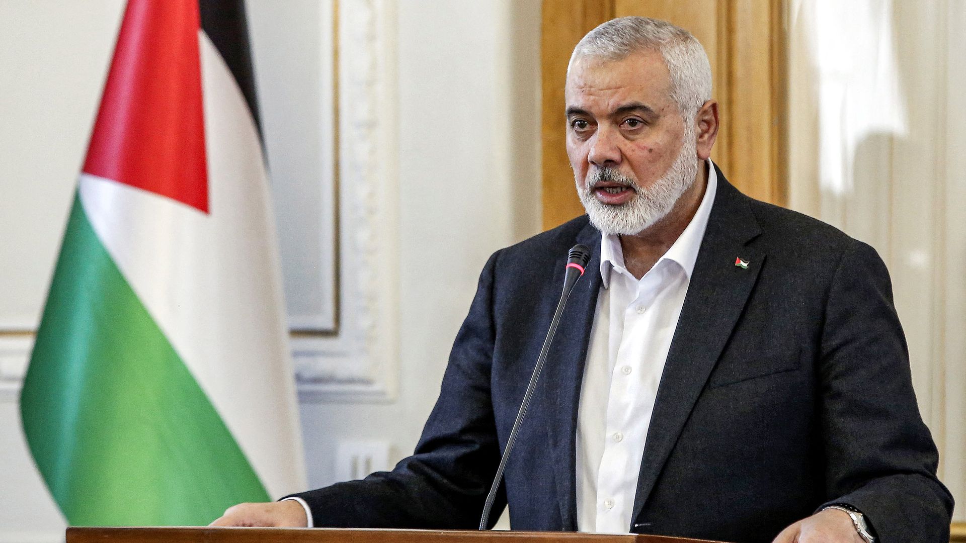 Ismail Haniyeh, the Doha-based political bureau chief of the Palestinian Islamist movement Hamas, speaks to the press after a meeting with the Iranian foreign minister in Tehran on March 26, 2024. 