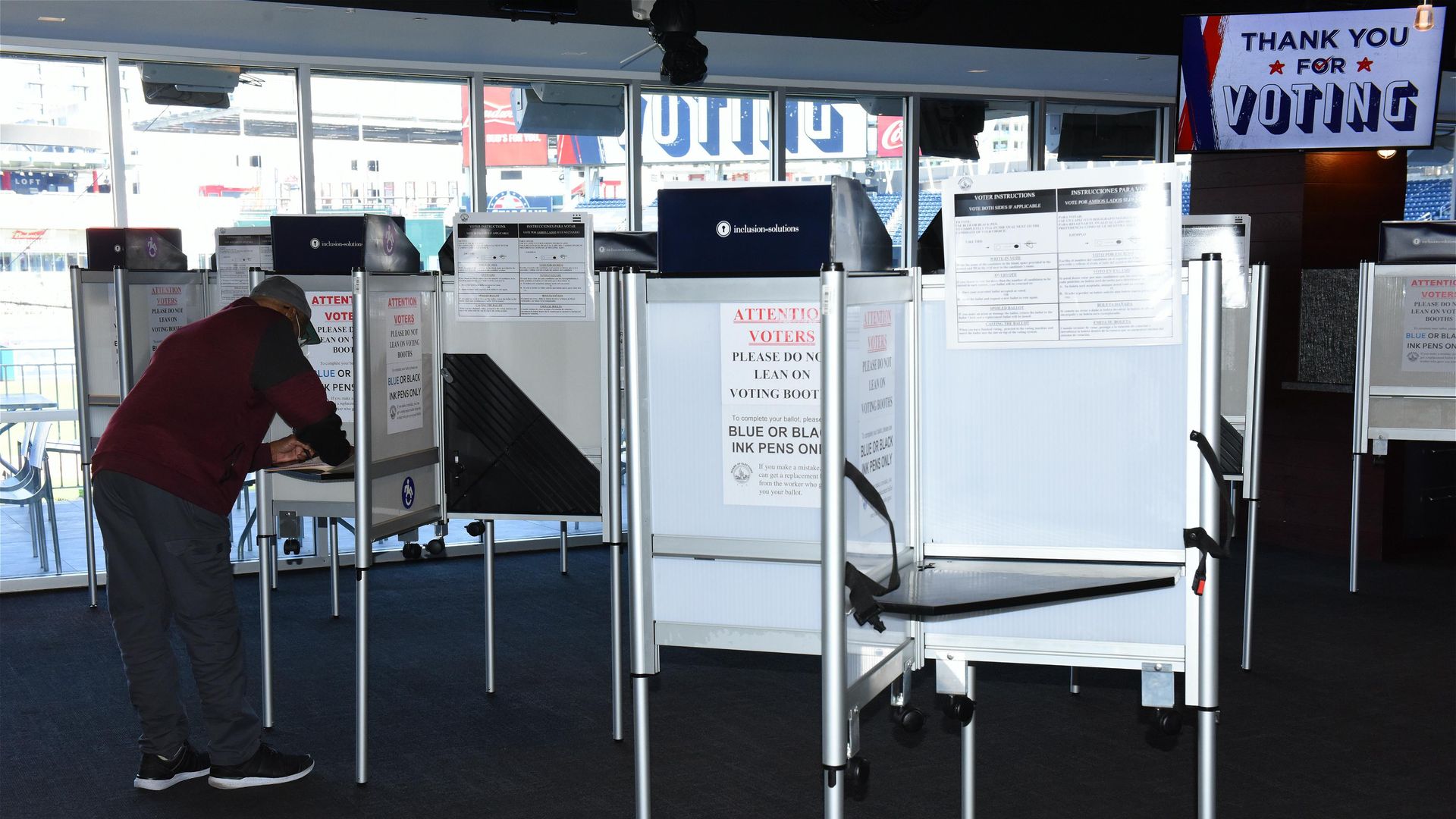 A voter casts his ballot for the 2020 U.S. presidential election at the Nationals Park baseball stadium