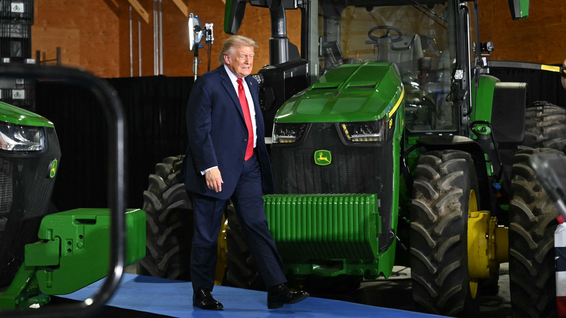 President Trump walks past a row of tractors as he arrives at Custer Farms for an agriculture-focused roundtable in Chippewa Falls, Wis. on June 5, 2026.