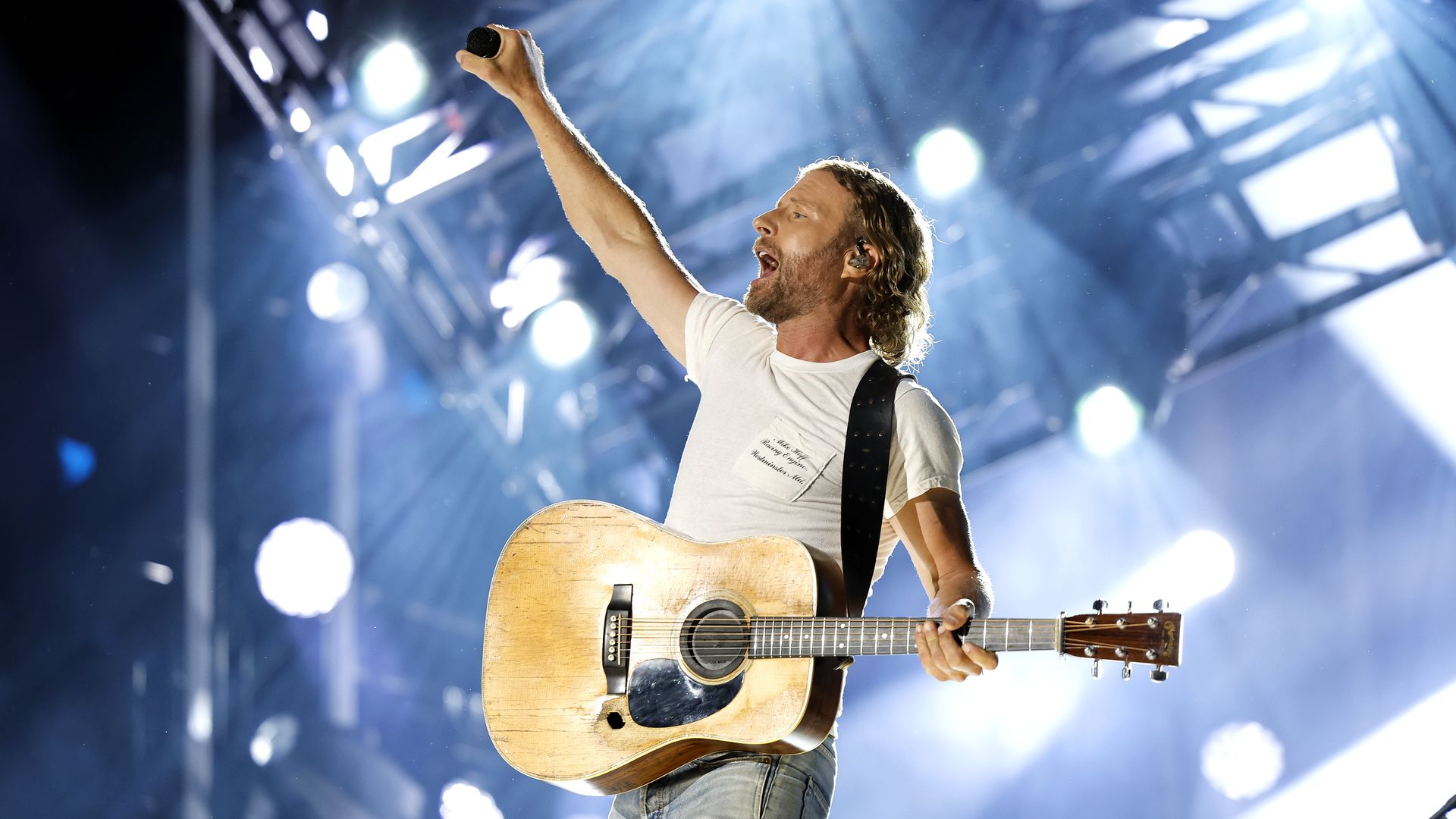 Dierks Bentley on stage with a guitar. 