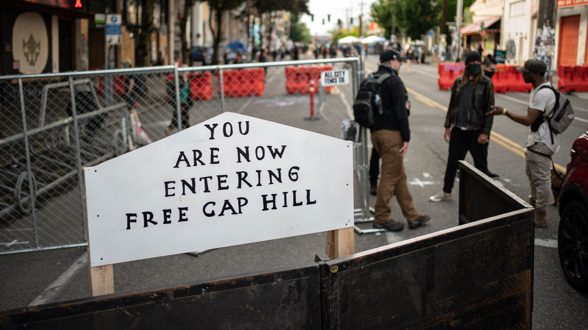  A sign is seen on a barrier at an entrance to the so-called "Capitol Hill Autonomous Zone" on June 10