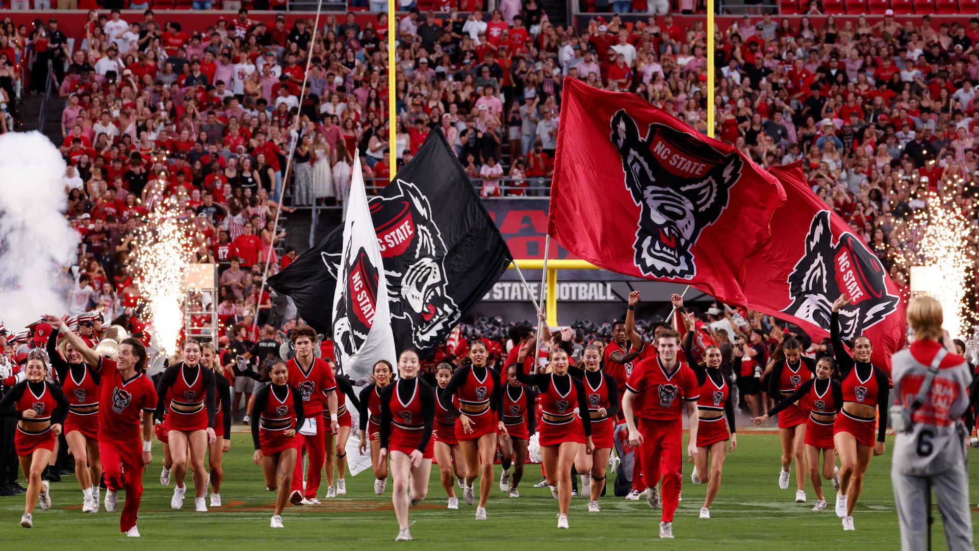 Cheerleaders of the NC State Wolfpack run onto the field prior to the game against the Virginia Tech Hokies at Carter-Finley Stadium on September 27, 2025 in Raleigh, North Carolina. (Photo by Lance King/Getty Images)