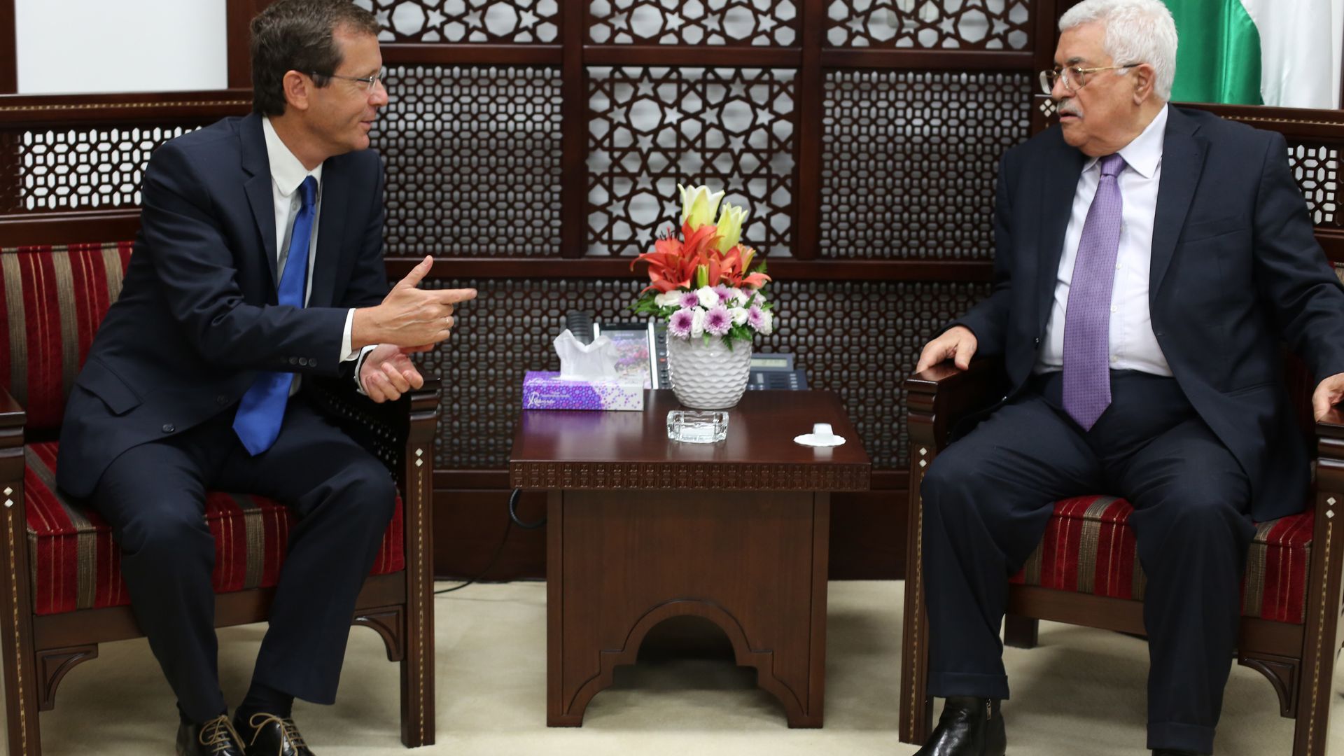 Isaac Herzog (L), then the leader of the opposition, meets with Mahmoud Abbas in 2015