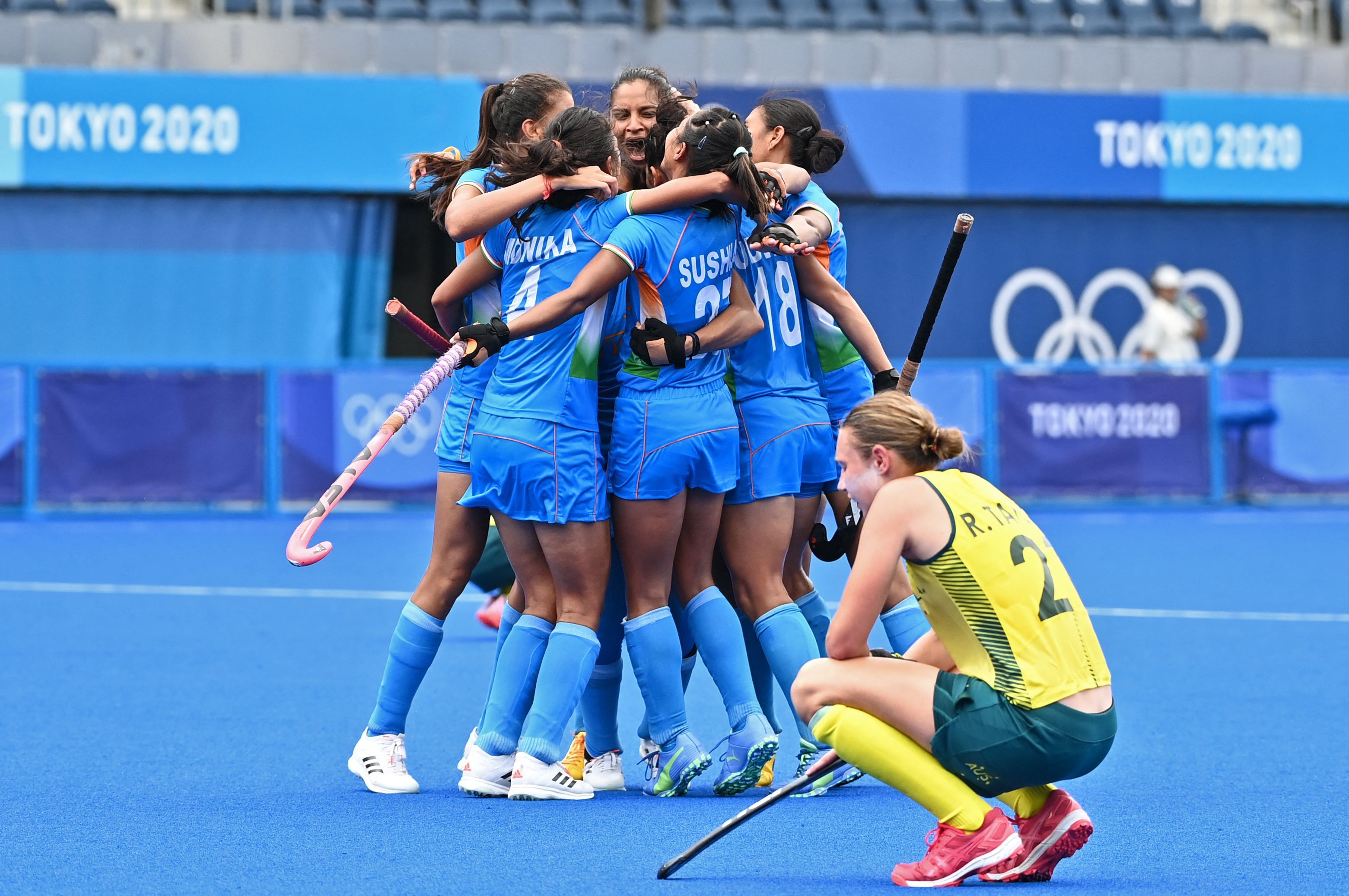 Players of India celebrate after defeating Australia 1-0 in their women's quarter-final match of the Tokyo 2020 Olympic Games field hockey competition Aug. 2