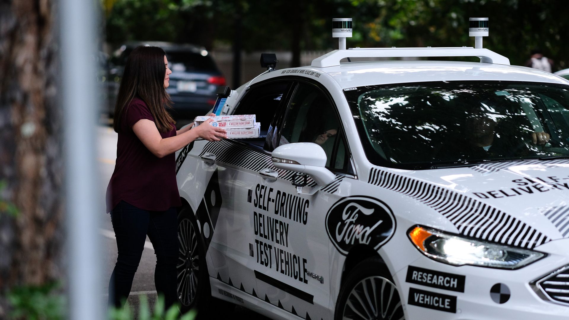 A Ford Domino's delivery car