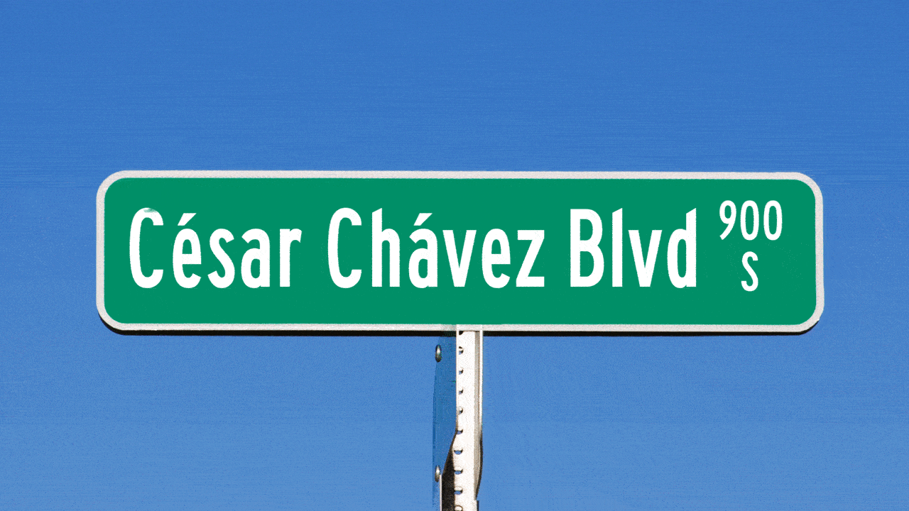 Animated illustration of a street sign that reads "César Chávez Blvd" being wiped clean.