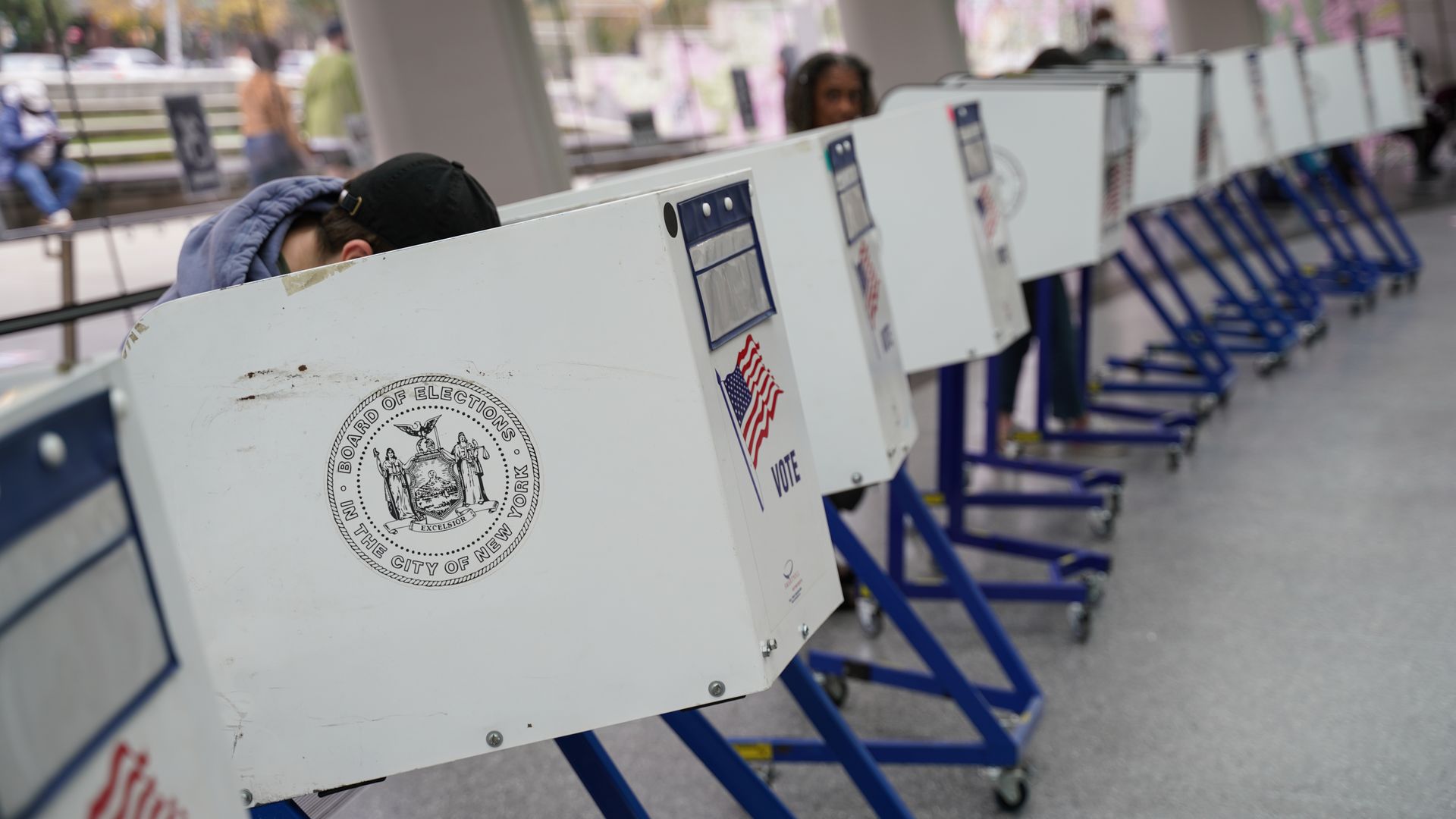 Voters cast their ballots at a polling station during early voting at the Brooklyn Museum in Brooklyn.