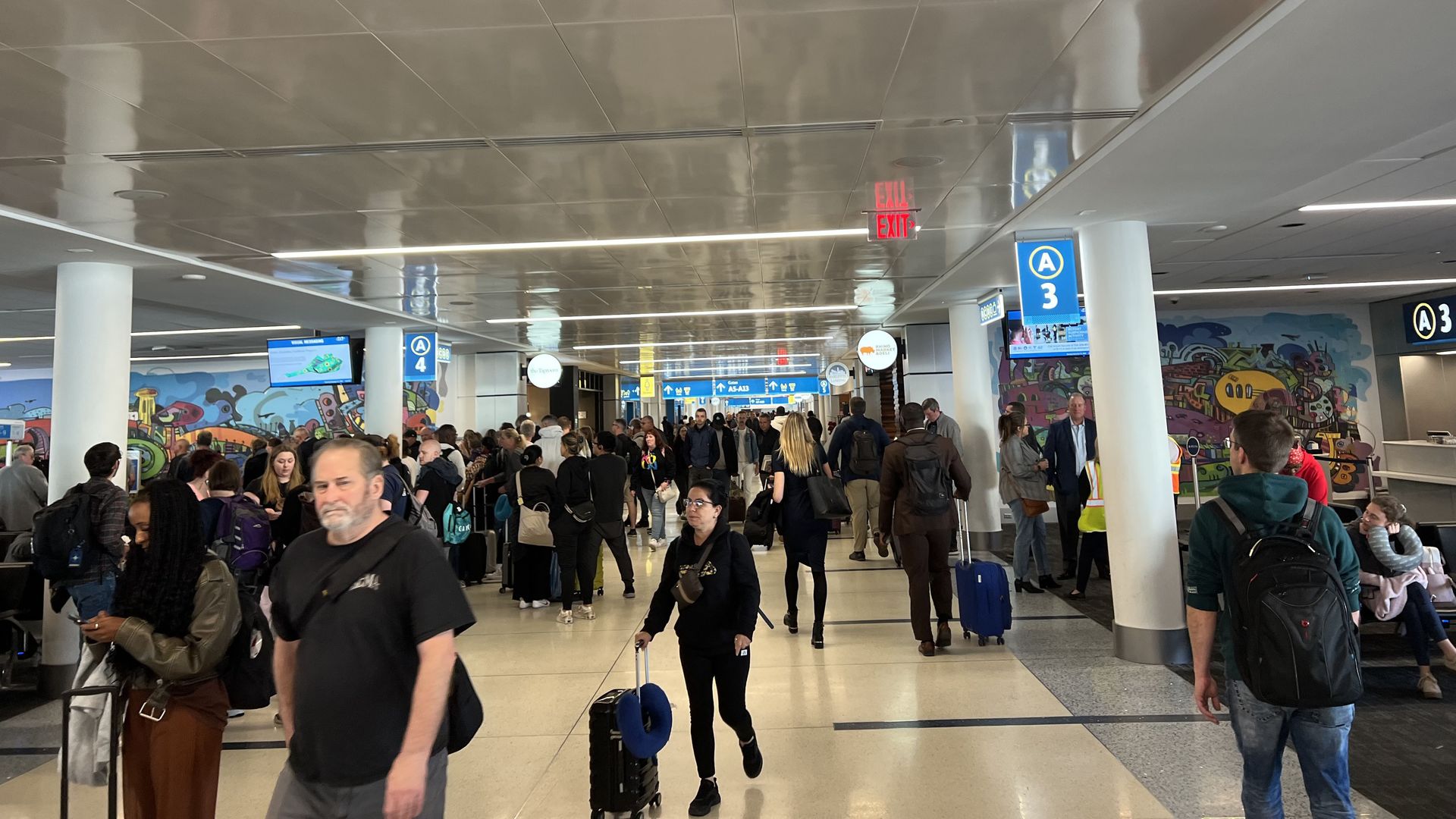 Passengers moving through Charlotte Douglas International Airport.