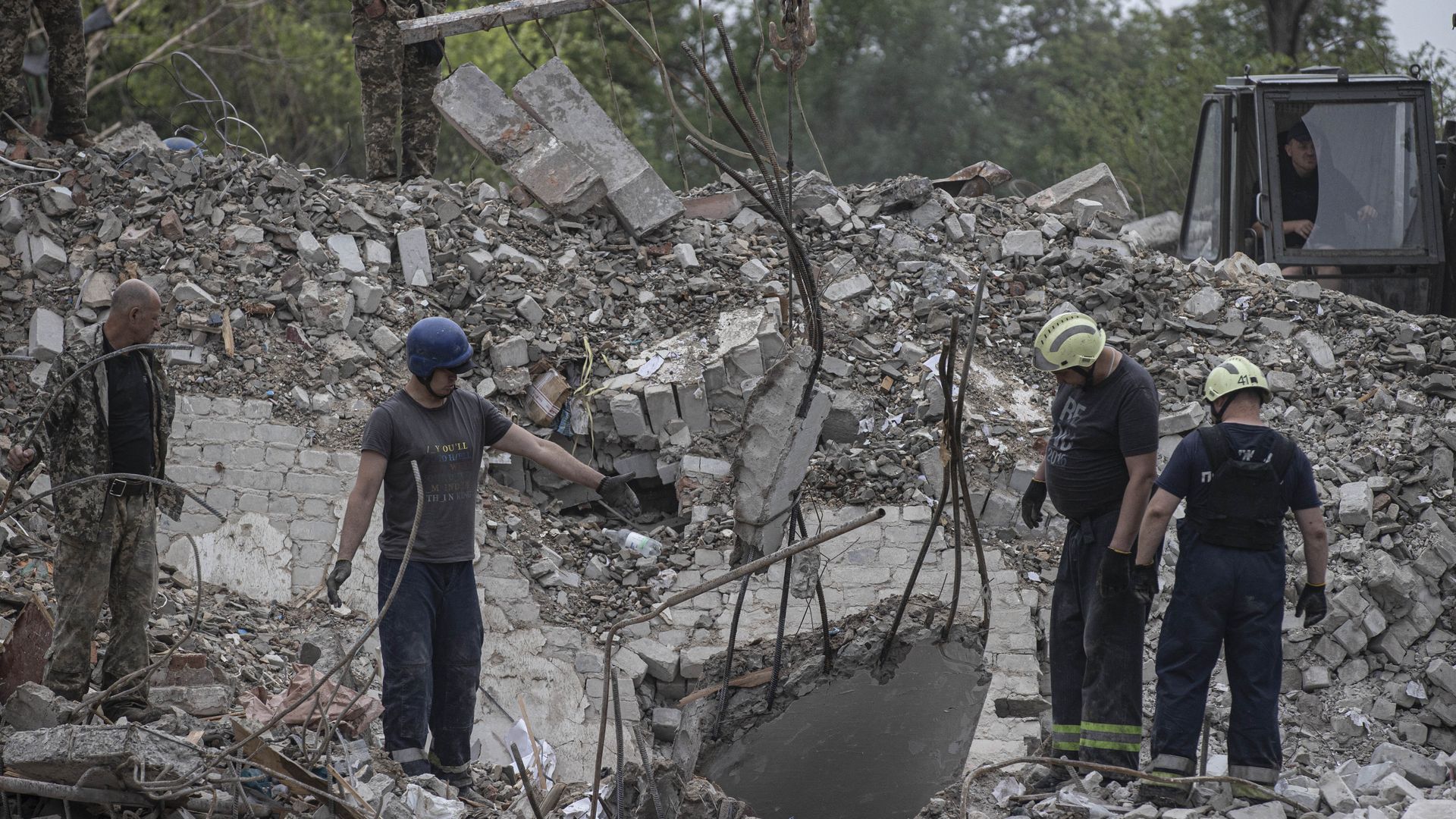 Firefighters conduct search and rescue operations on debris of buildings after Russian airstrikes hit residential areas in Chasiv Yar, Donetsk, Ukraine on July 11