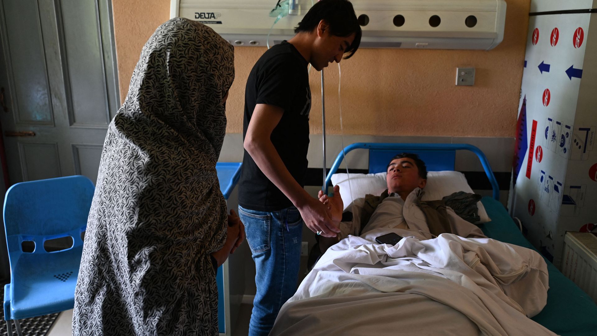Relatives visit a wounded youth at a hospital in Kabul on April 19.