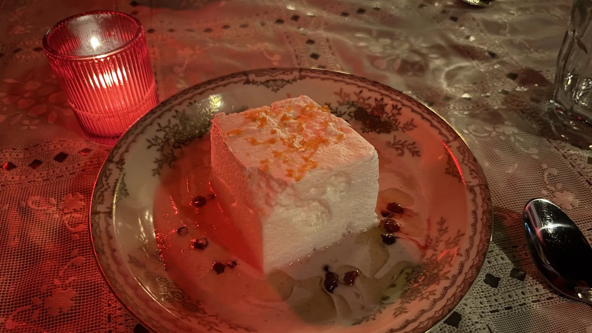 Fet Fisk's floating island dessert hovering on a pool of rich brown butter and lingonberries