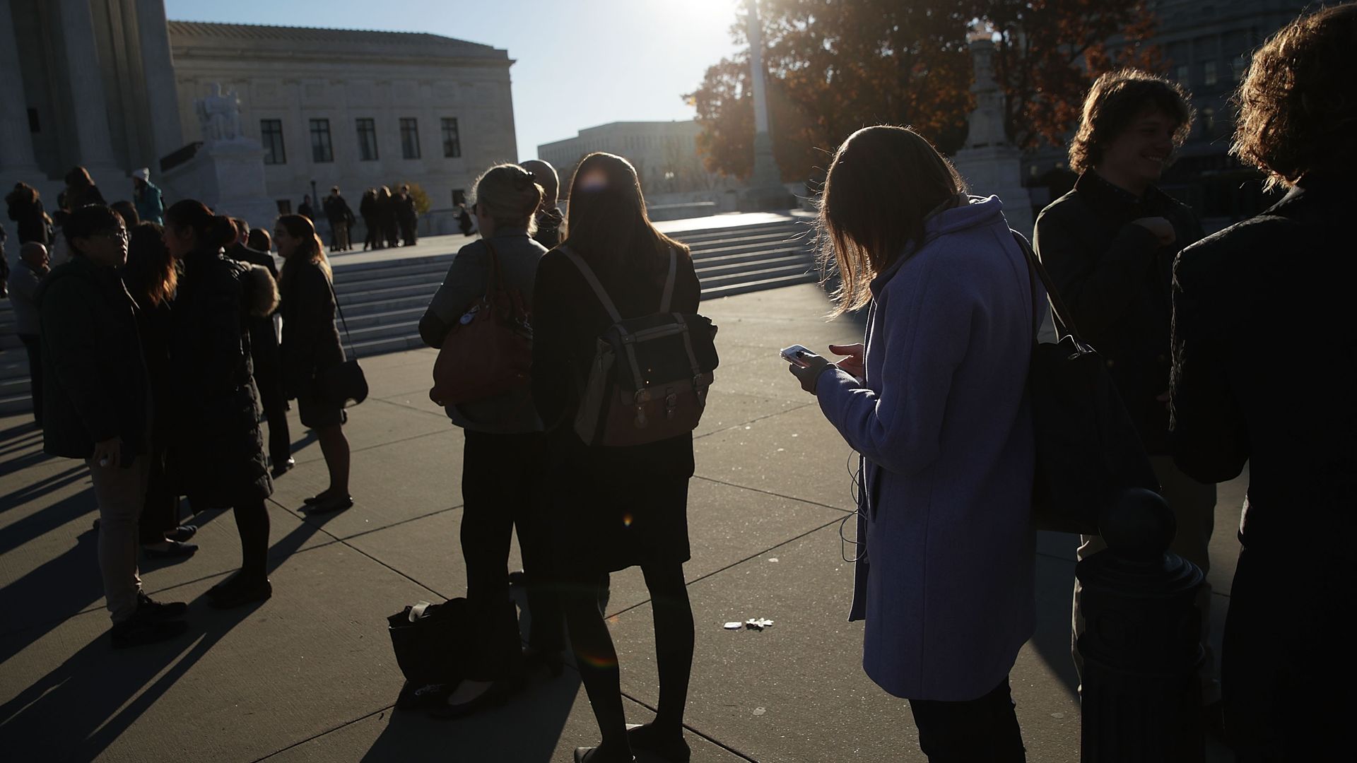 Cell phone users outside the Supreme Court in November