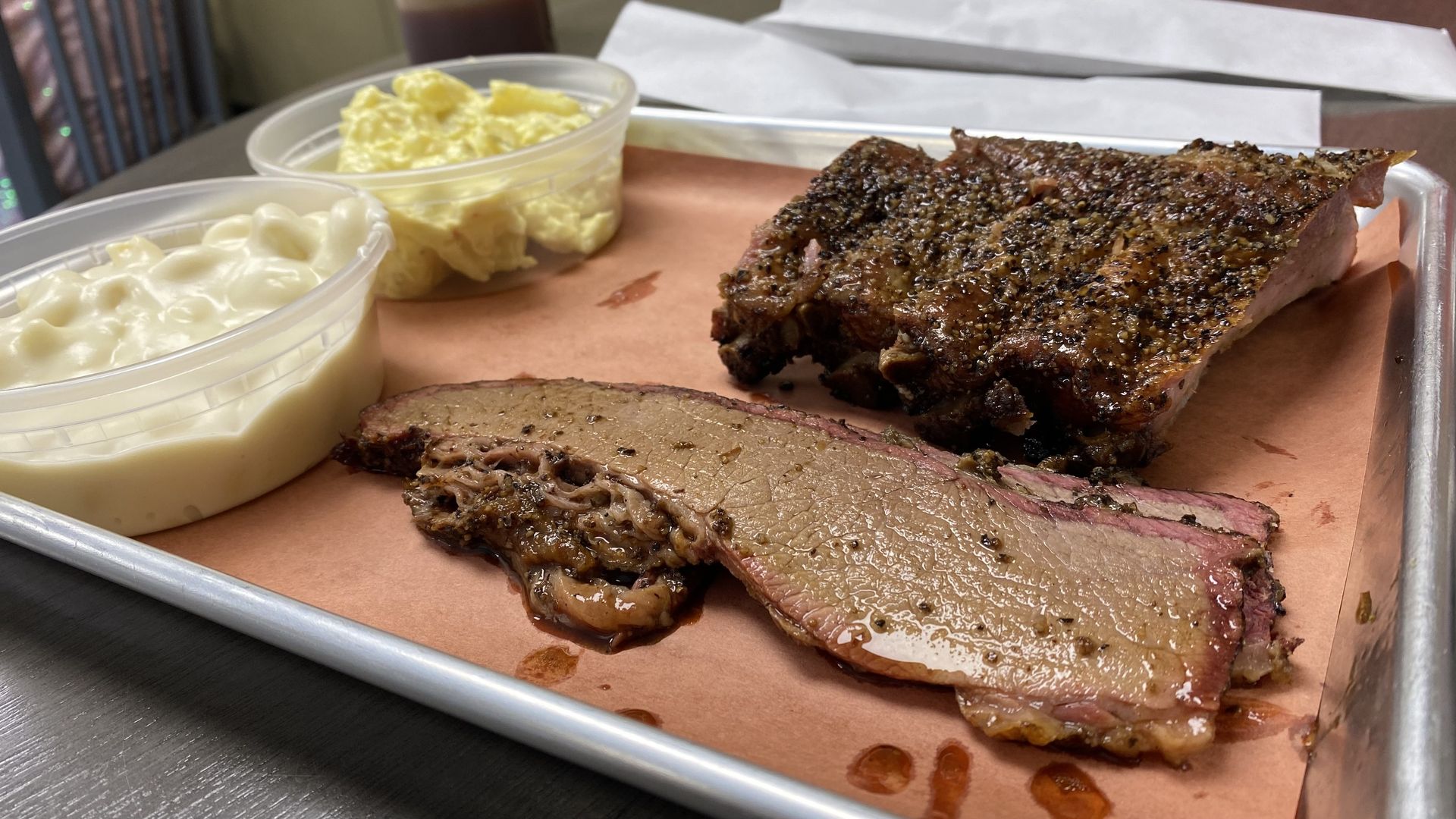 A plate of brisket and ribs. 