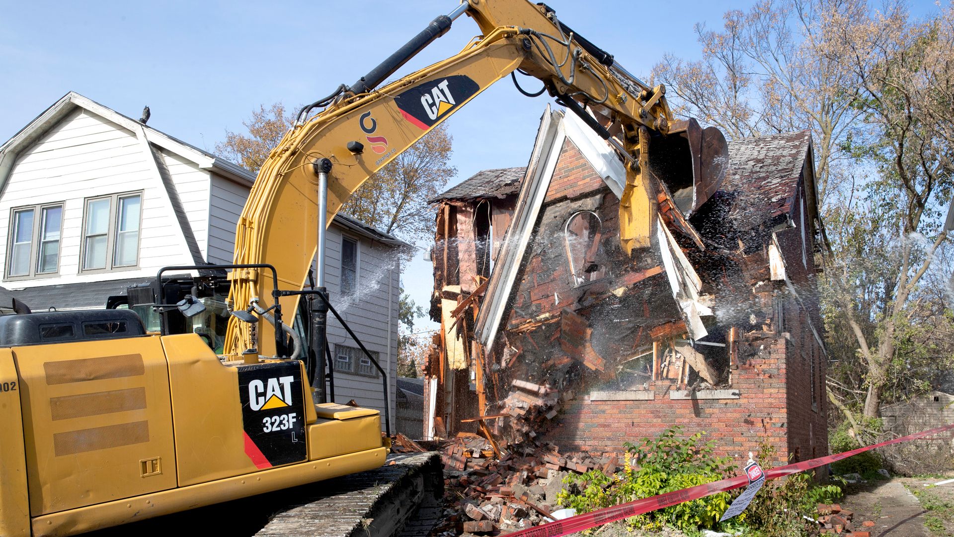 A Detroit home being demolished.