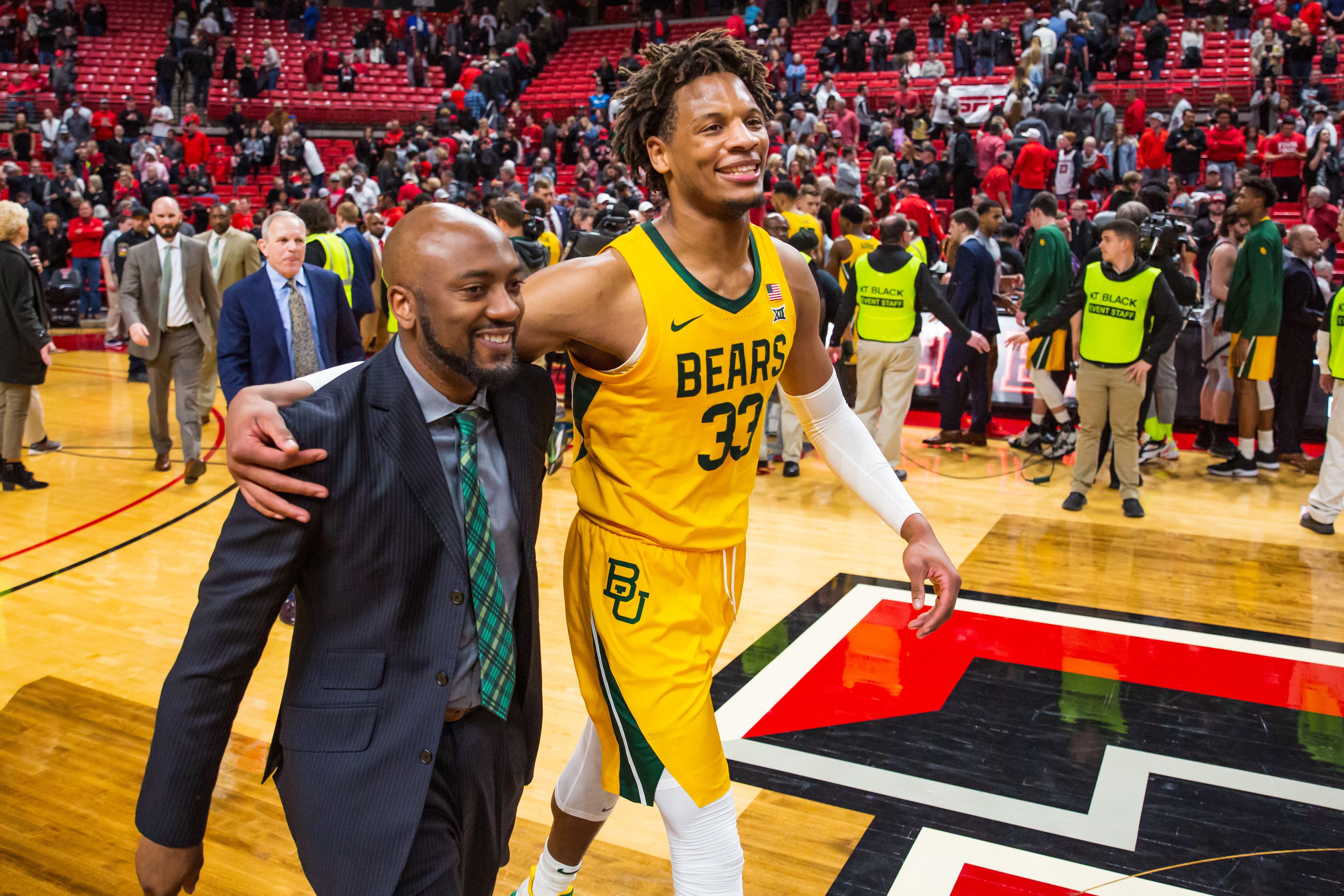 Baylor playing and coach smiling