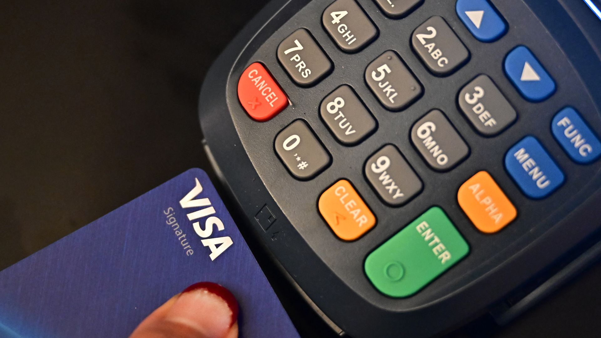 A credit card touches a credit card reader