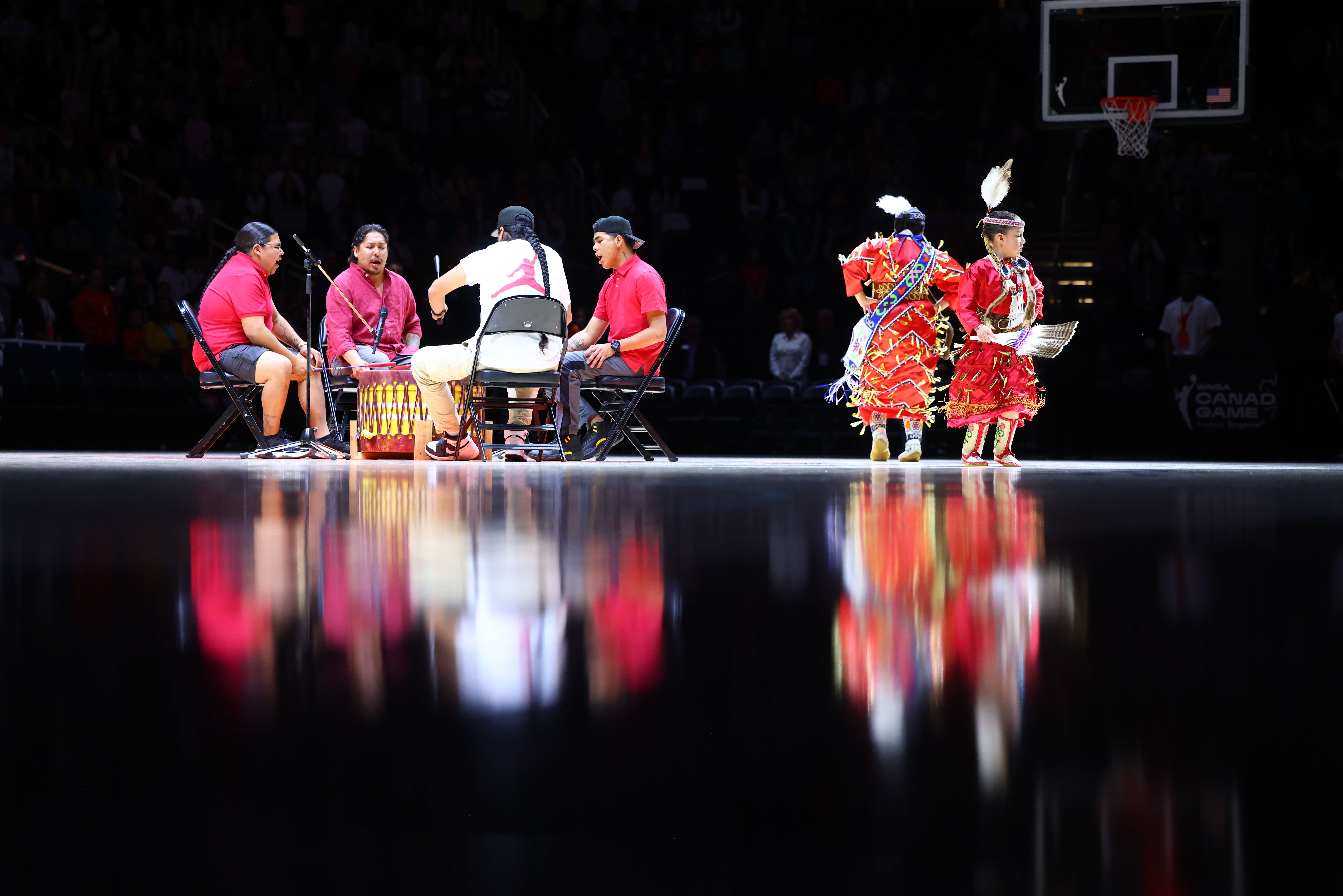A Native American tribe performs during the game between the Seattle Storm and the Los Angeles Sparks on May 4, 2024 at Rodgers Place in Edmonton, Canada.