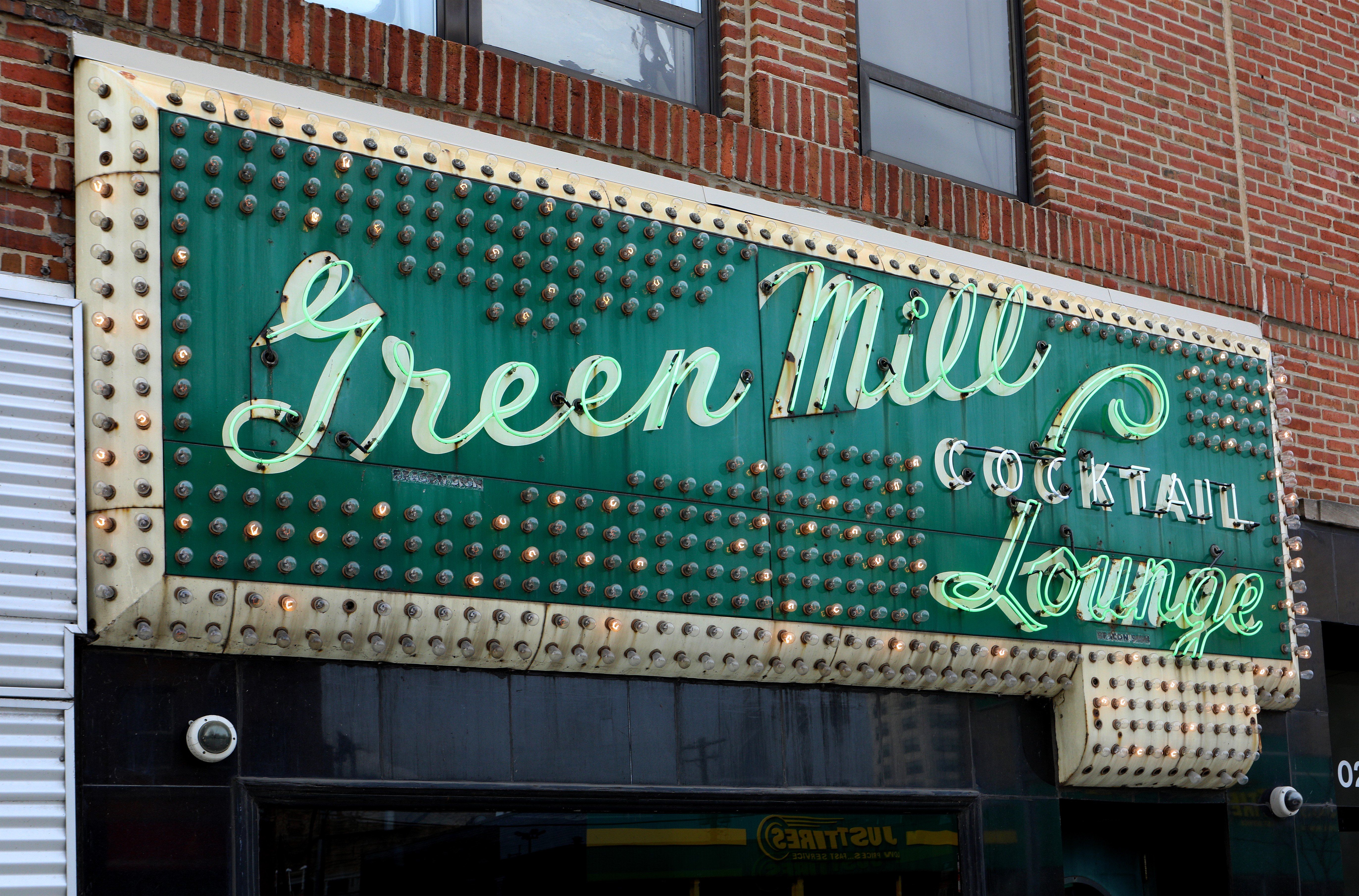 Photo of a sign saying "Green Mill Cocktail Lounge" 